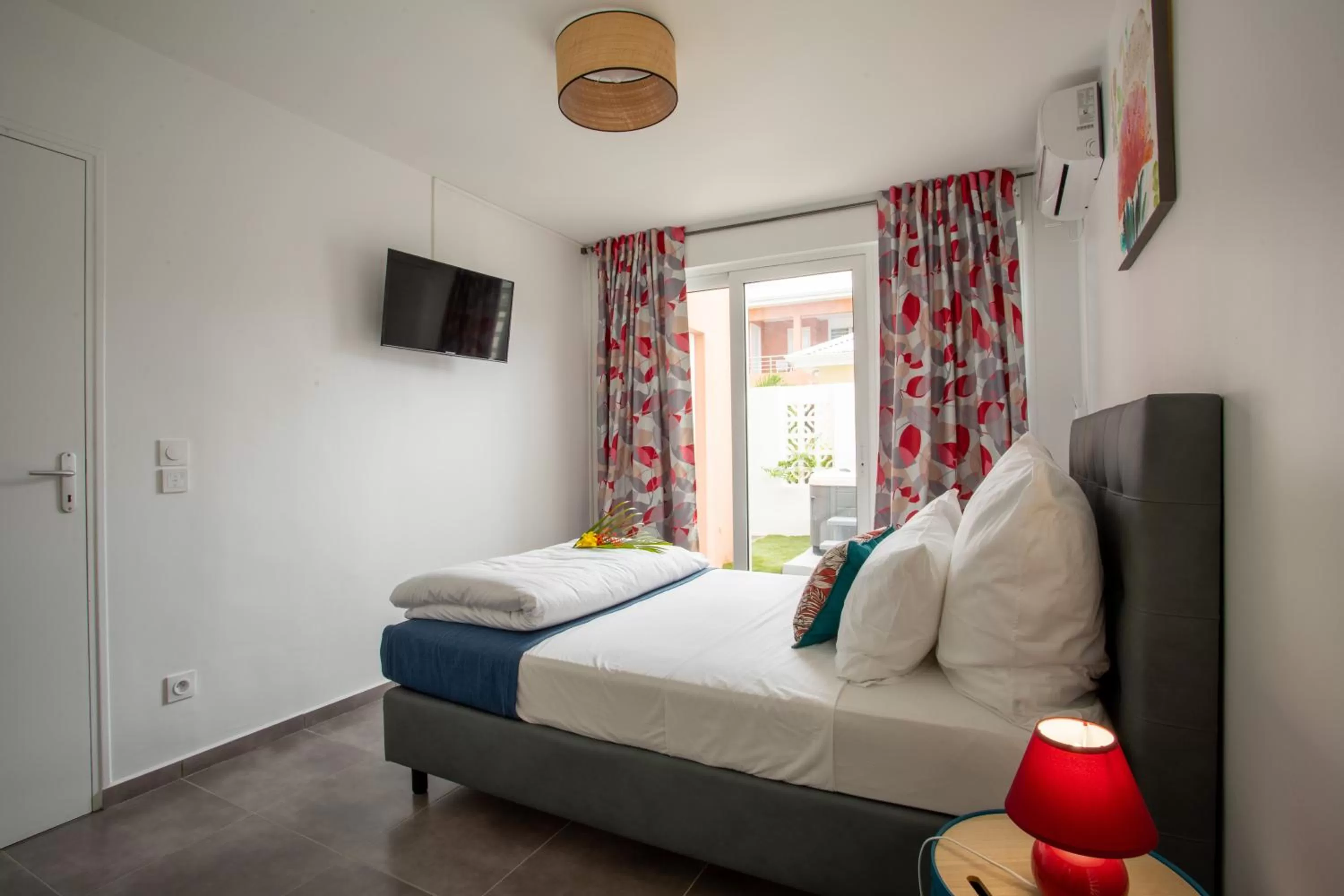 Bed in Hôtel Guadeloupe Palm Suites