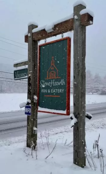 Property logo or sign in Stone Hearth Inn and Eatery