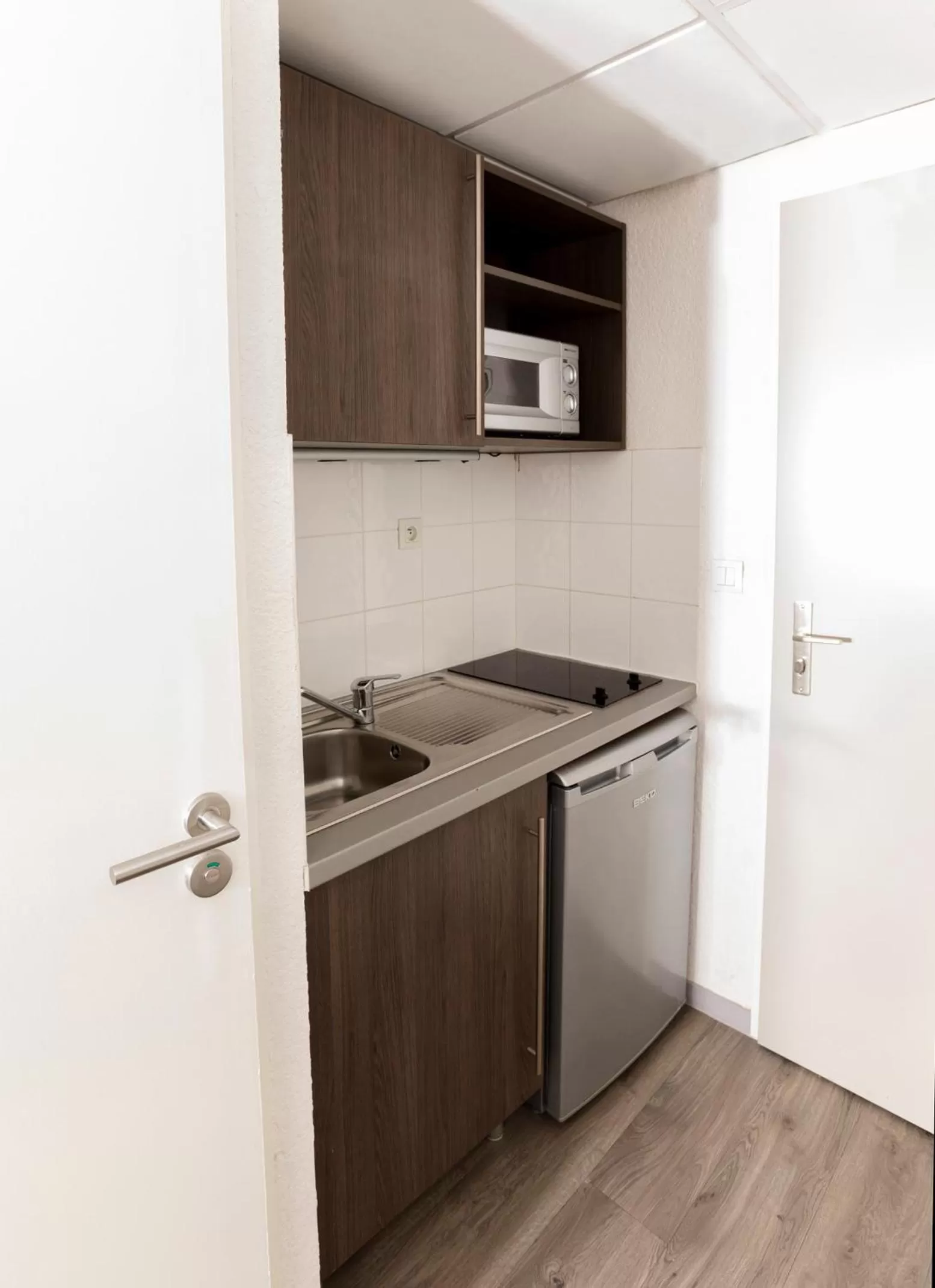 Kitchen or kitchenette in Aparthotel Adagio Access Orléans