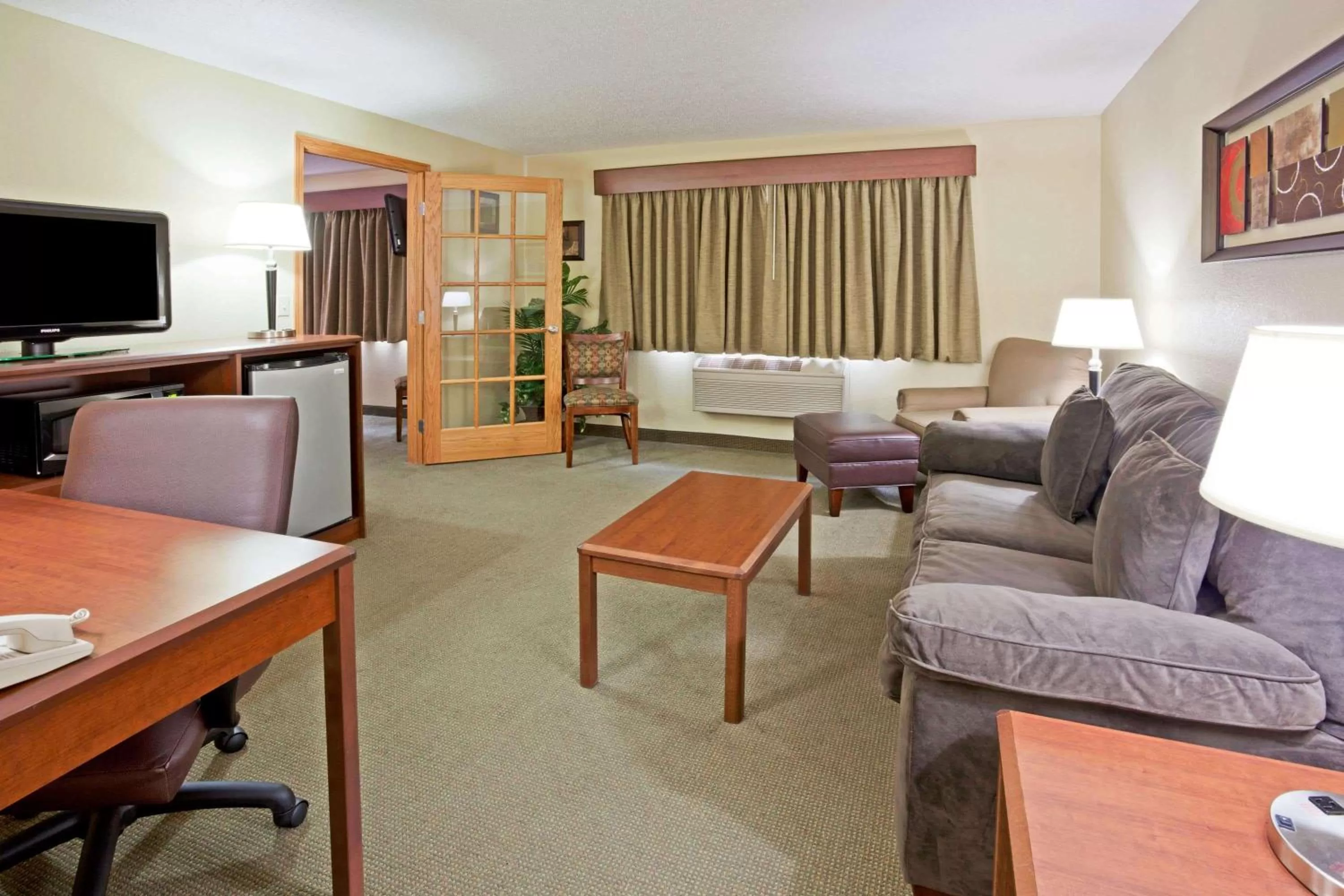 Living room in AmericInn by Wyndham Fargo West Acres