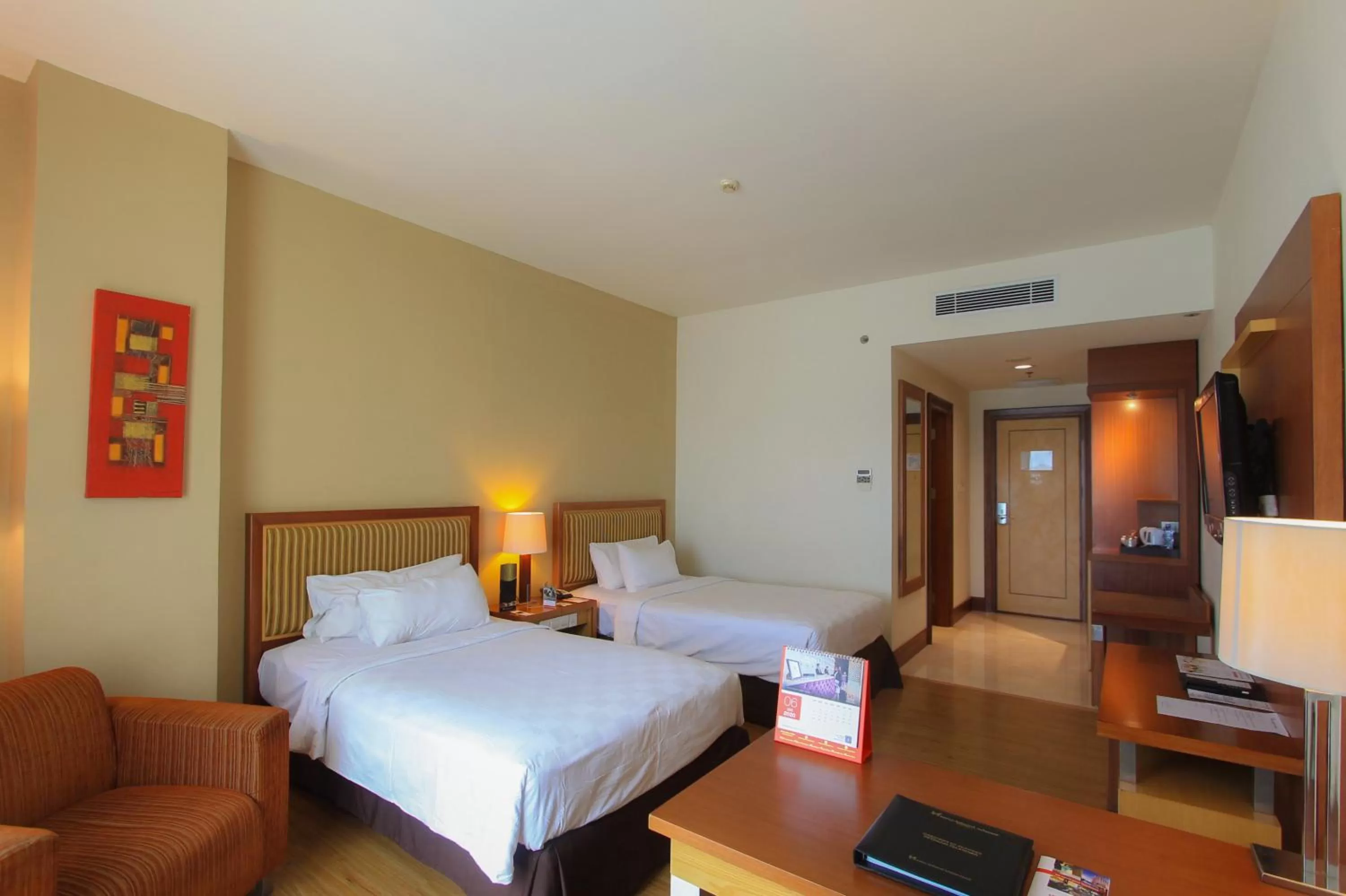 Bed in Swiss-Belhotel Maleosan Manado