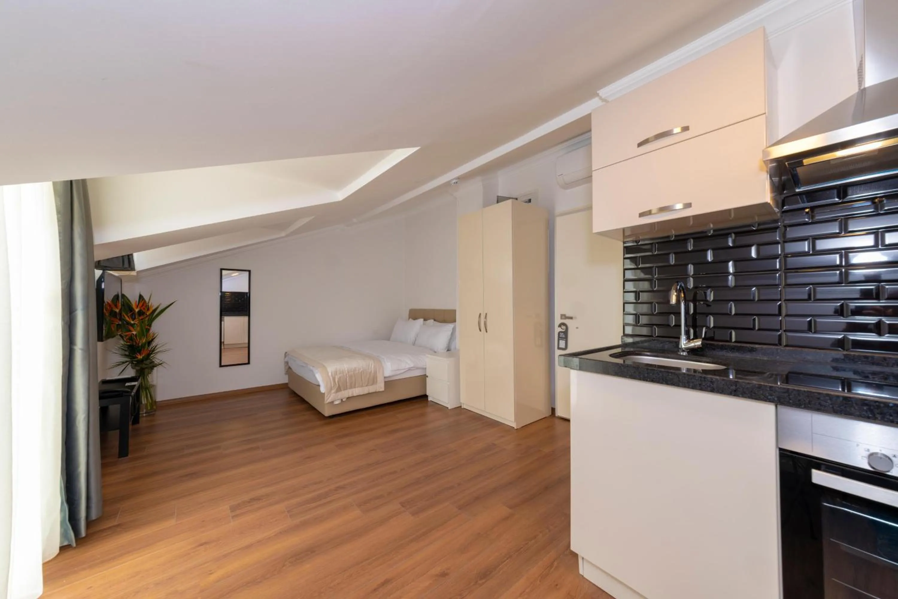 Kitchen or kitchenette, Bed in Joy Suites