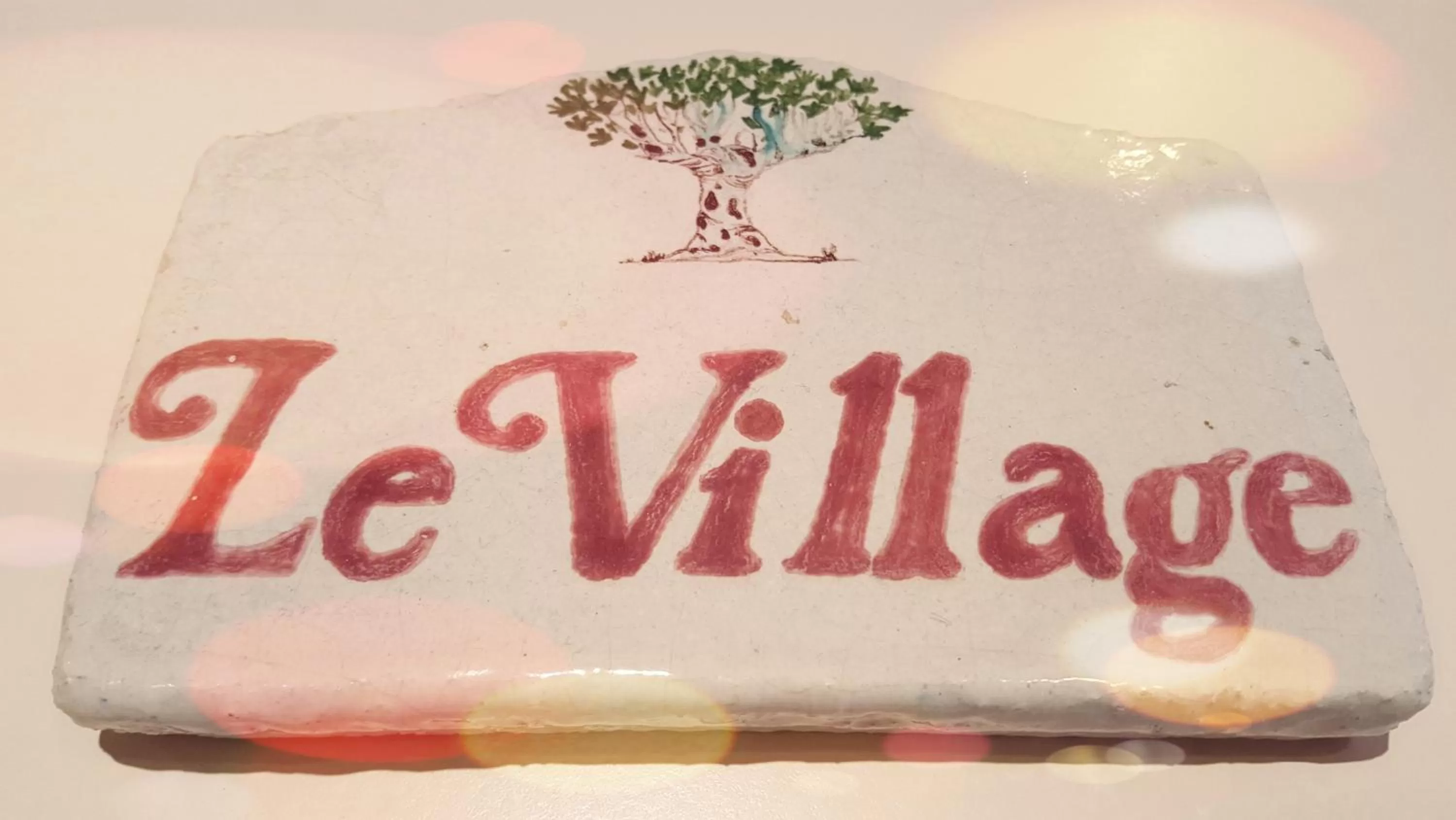 Property logo or sign in Hotel Le Village