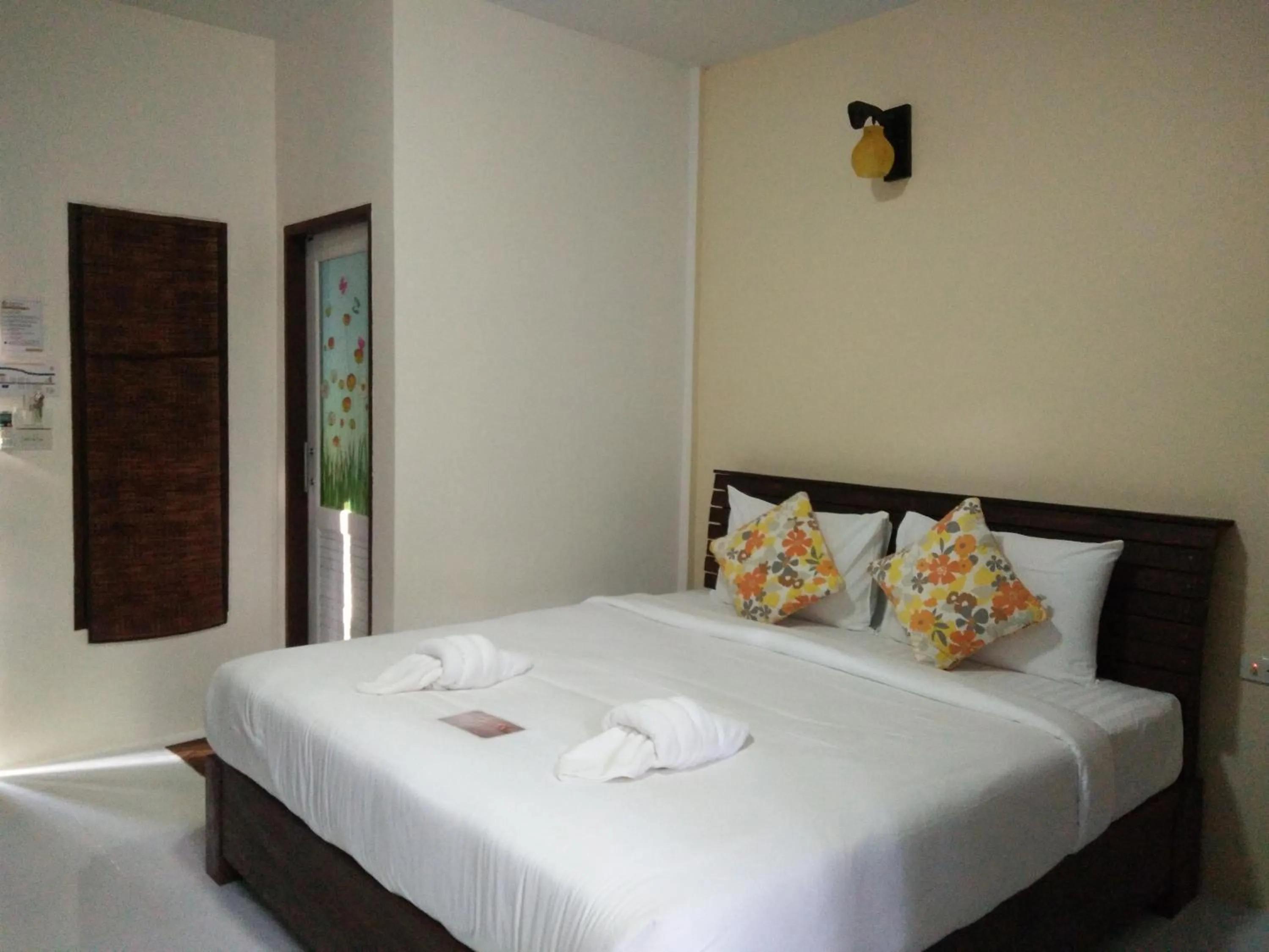 Bed in Baan Suan Rim Klong Resort
