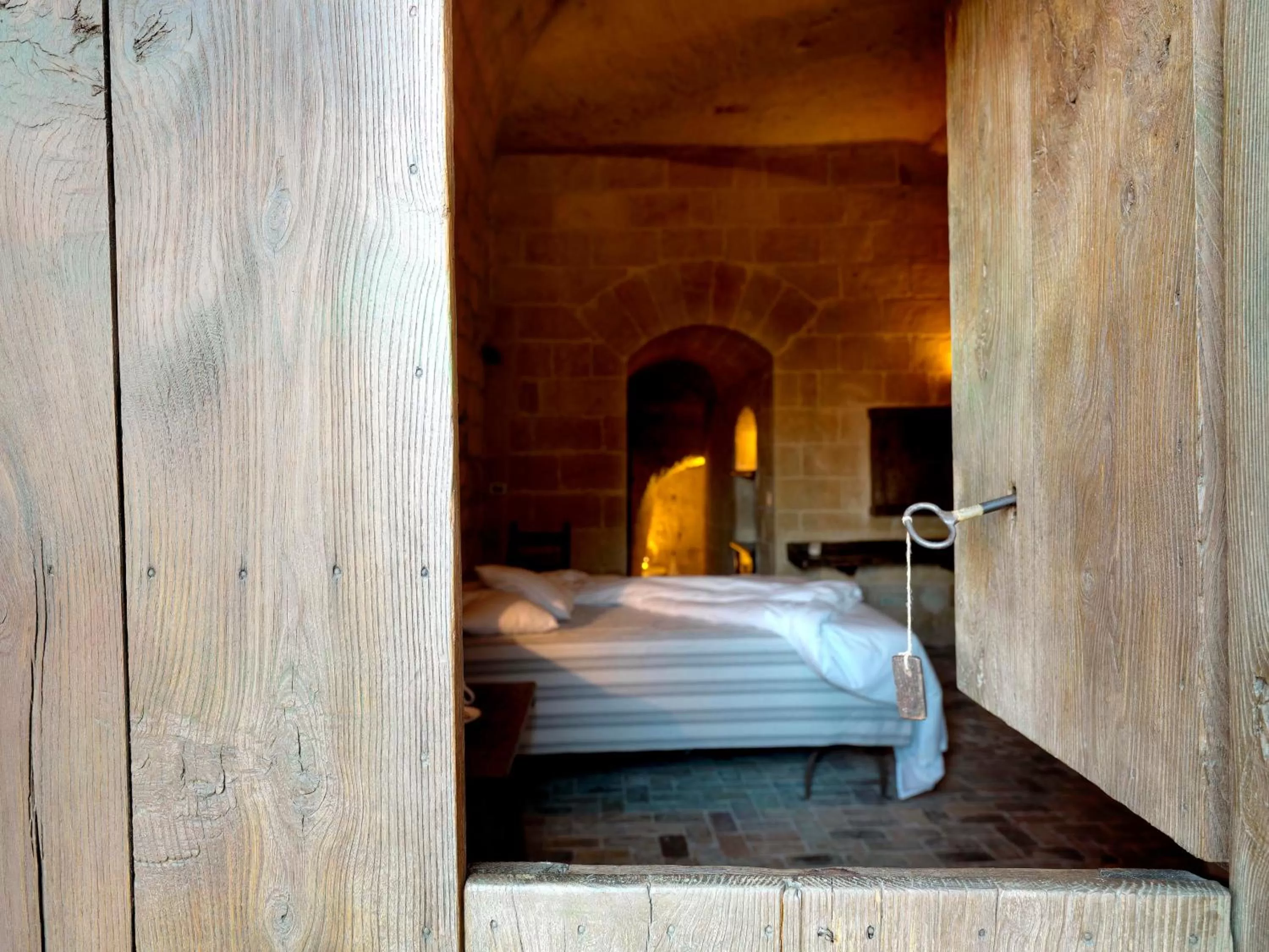 Photo of the whole room, Bed in Sextantio Le Grotte Della Civita