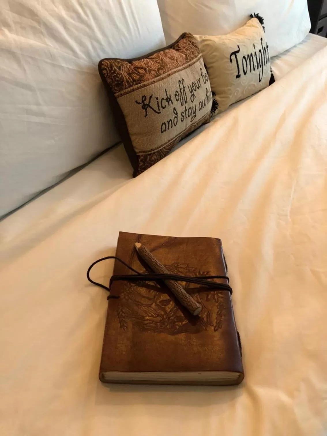 Bed in Cedar Stables Inn & Suites