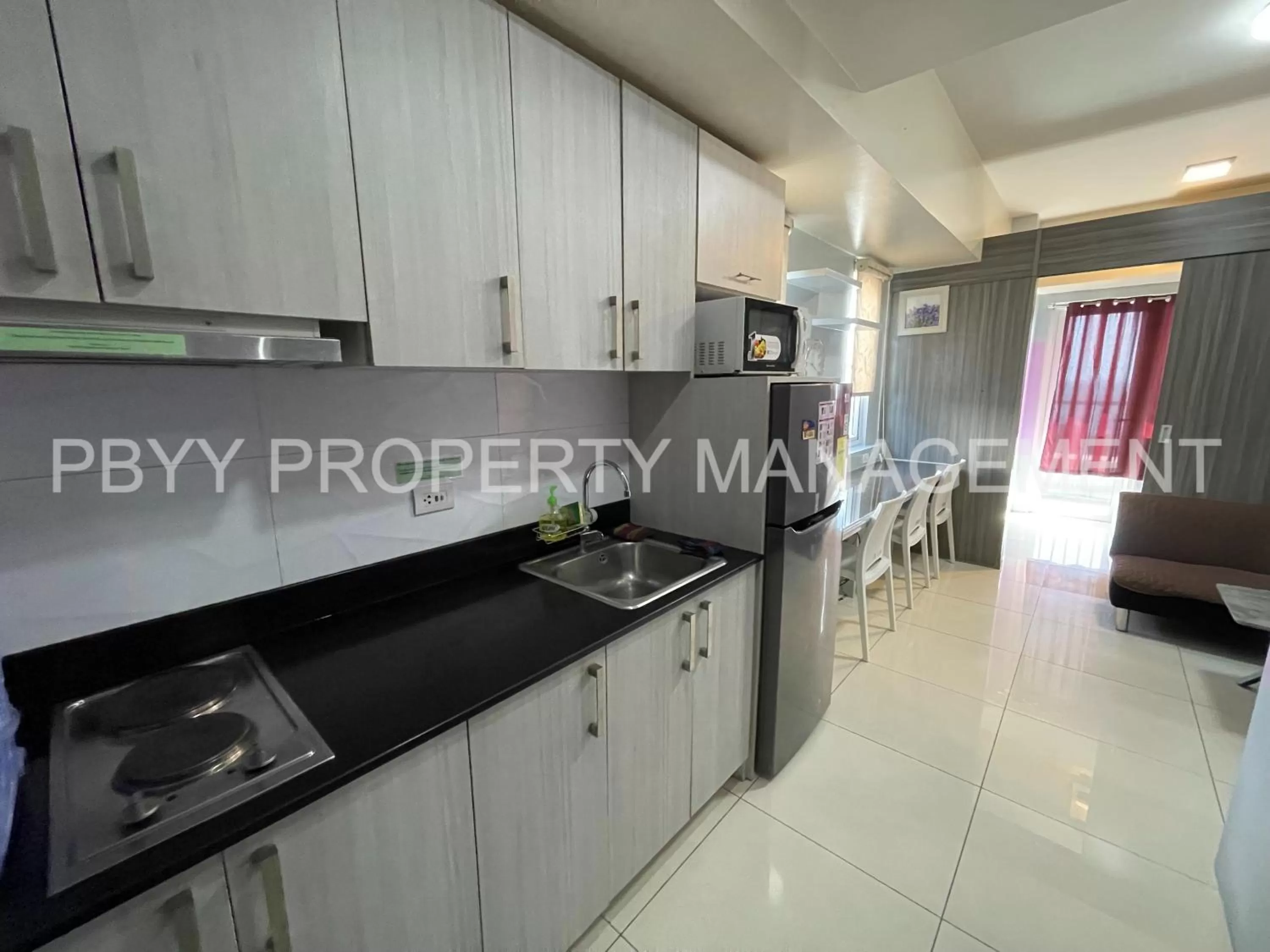 Kitchen or kitchenette, Kitchen/Kitchenette in Green Residences Staycation by PBYY