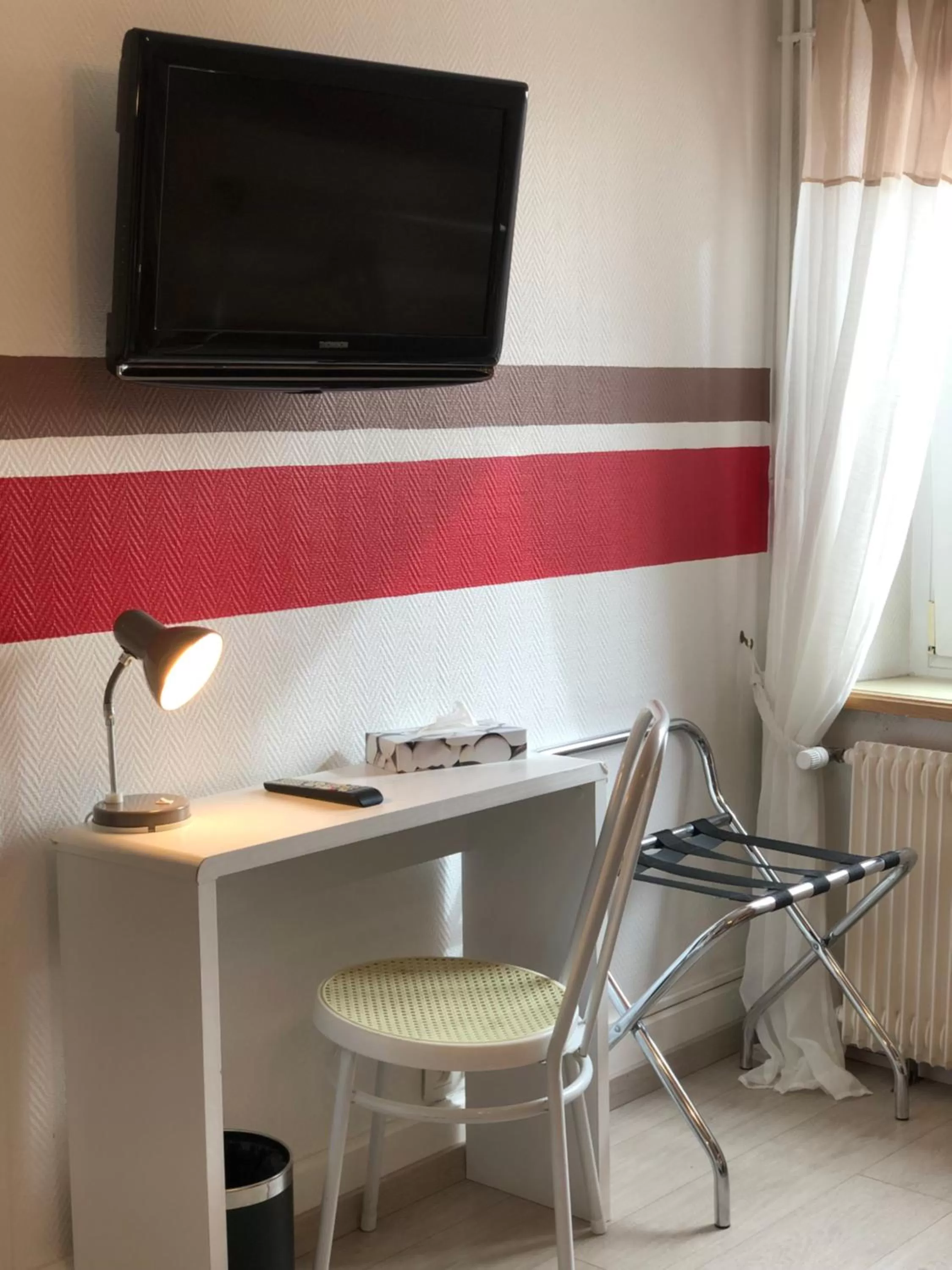 TV and multimedia, TV/Entertainment Center in Enzo Hotels Neufchâteau by Kyriad Direct