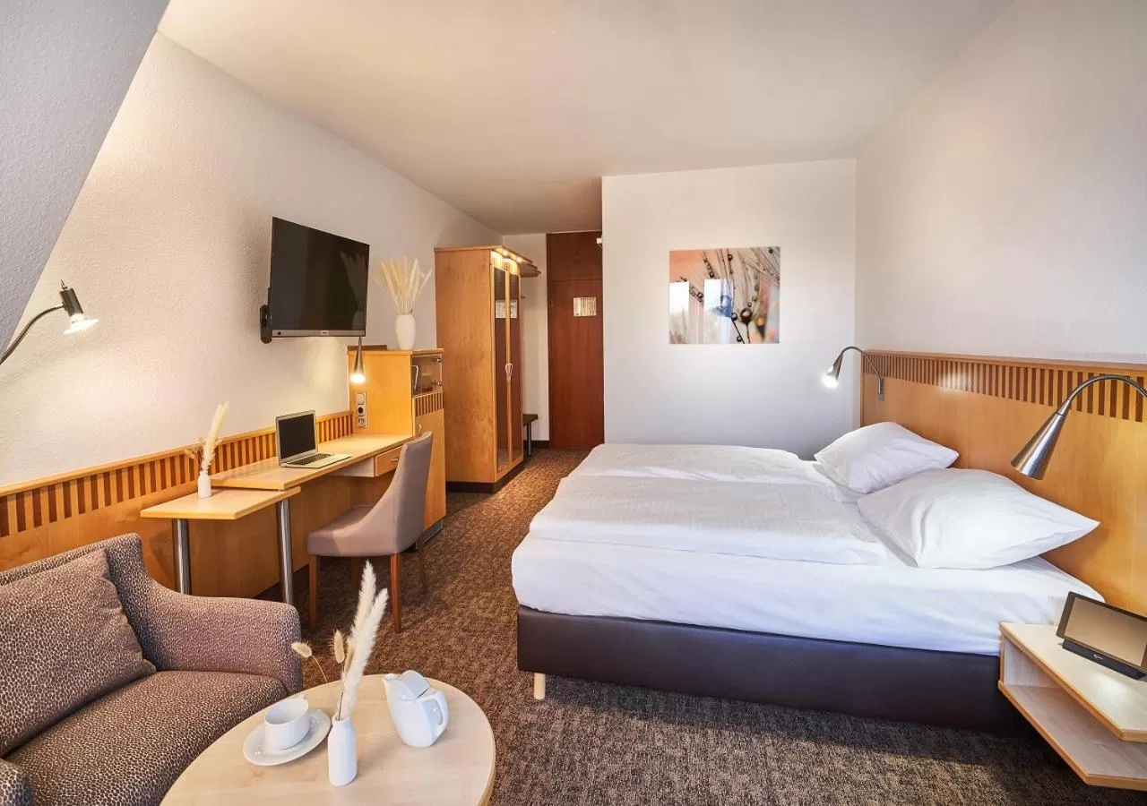 Photo of the whole room, Bed in Parkhotel Nümbrecht