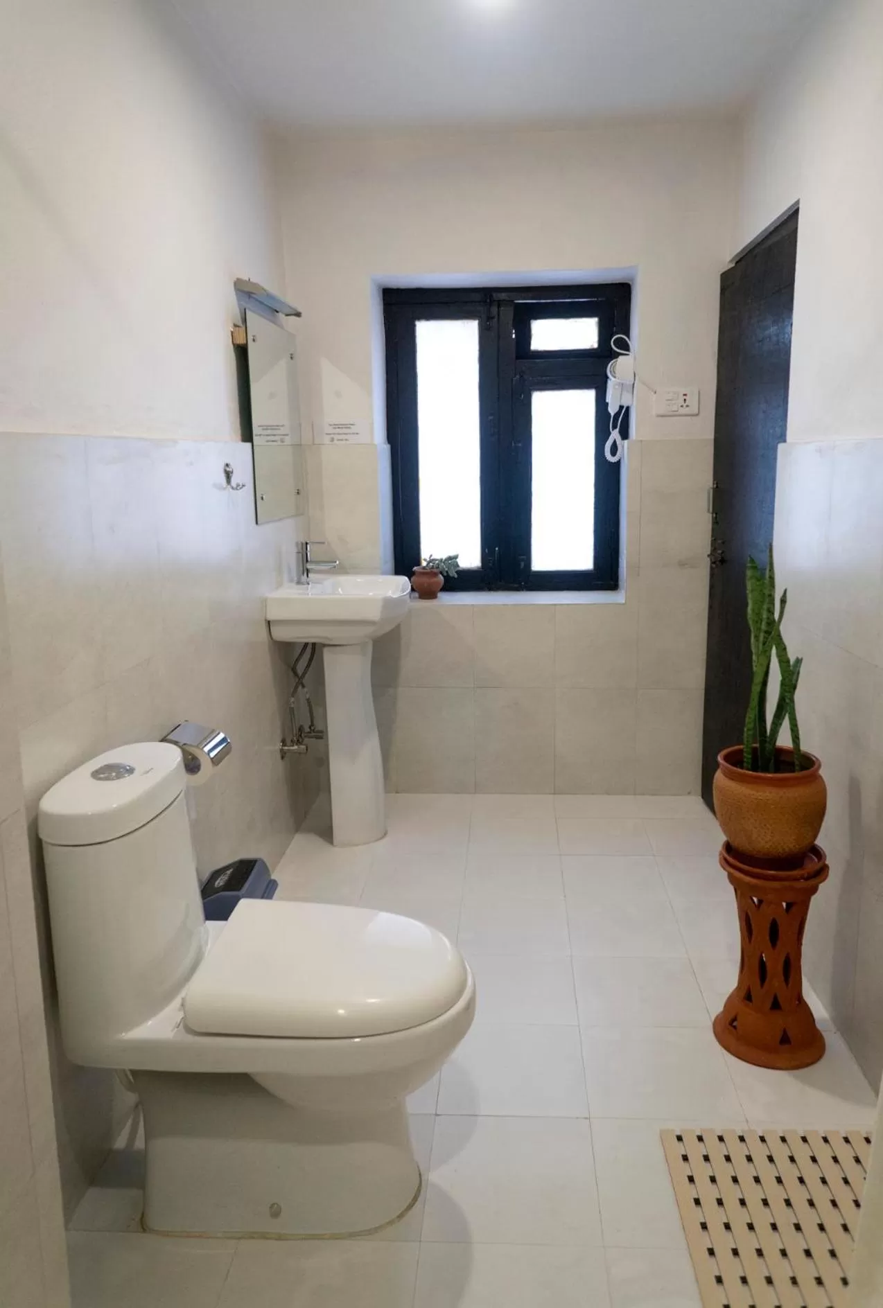 Bathroom in Omana Hotel