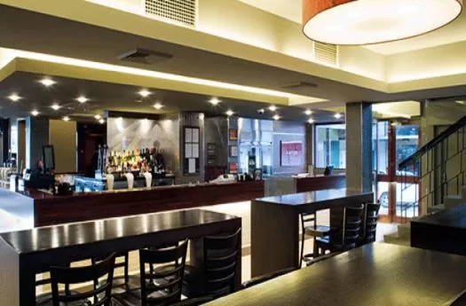 Lounge or bar in The Astor Hotel Motel