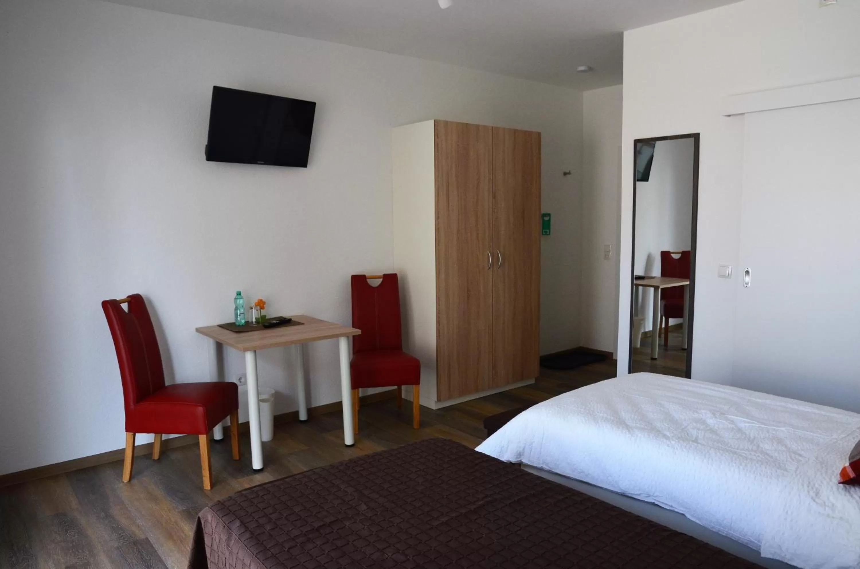 Photo of the whole room, TV/Entertainment Center in Gästehaus Am Hochsimmer