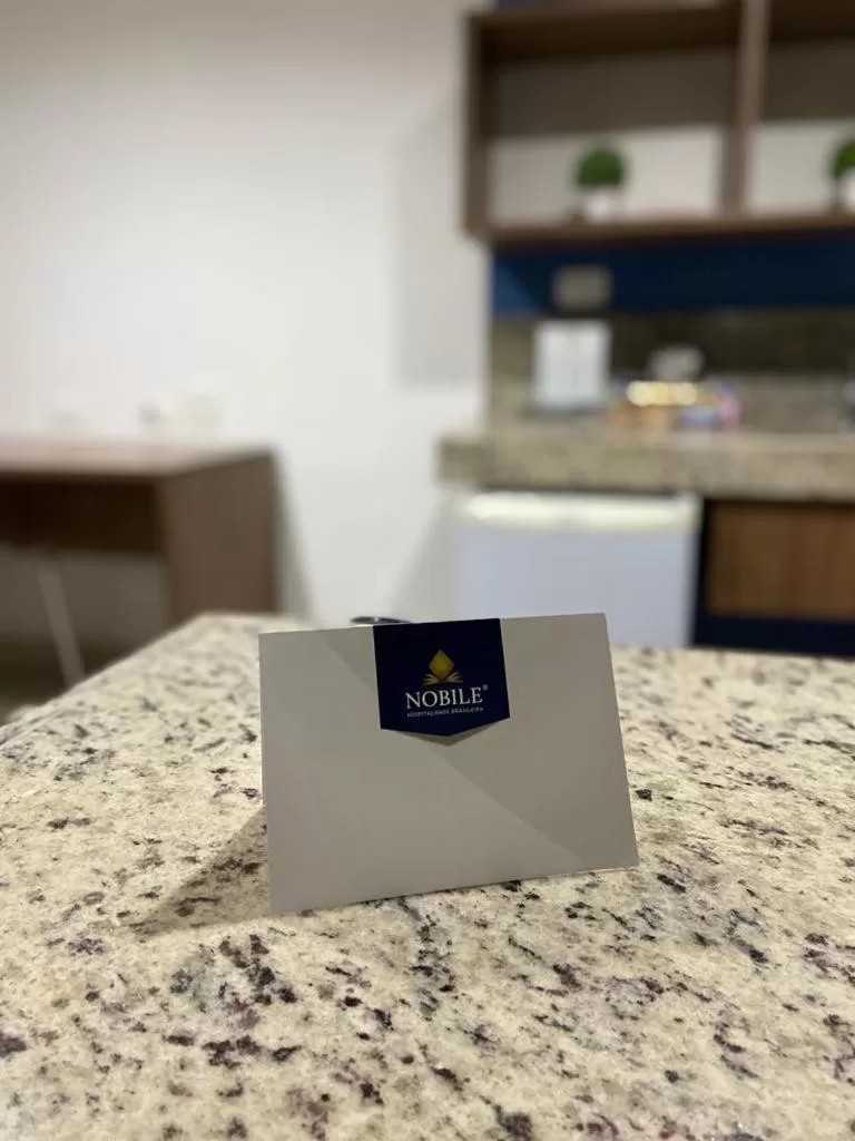 Property logo or sign in Nobile Suítes Tambaú