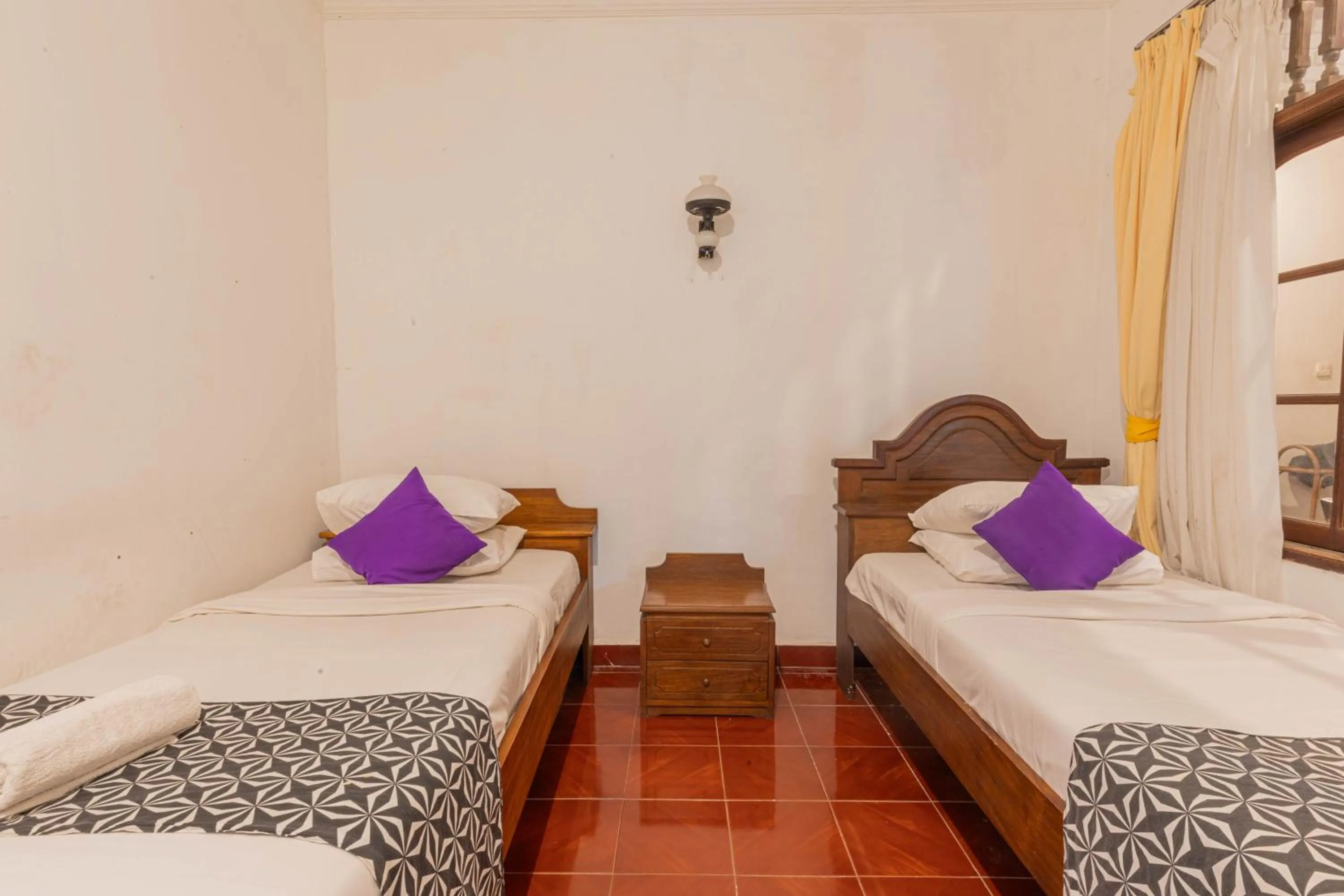 Bedroom in Puri Mango Guest House Sanur