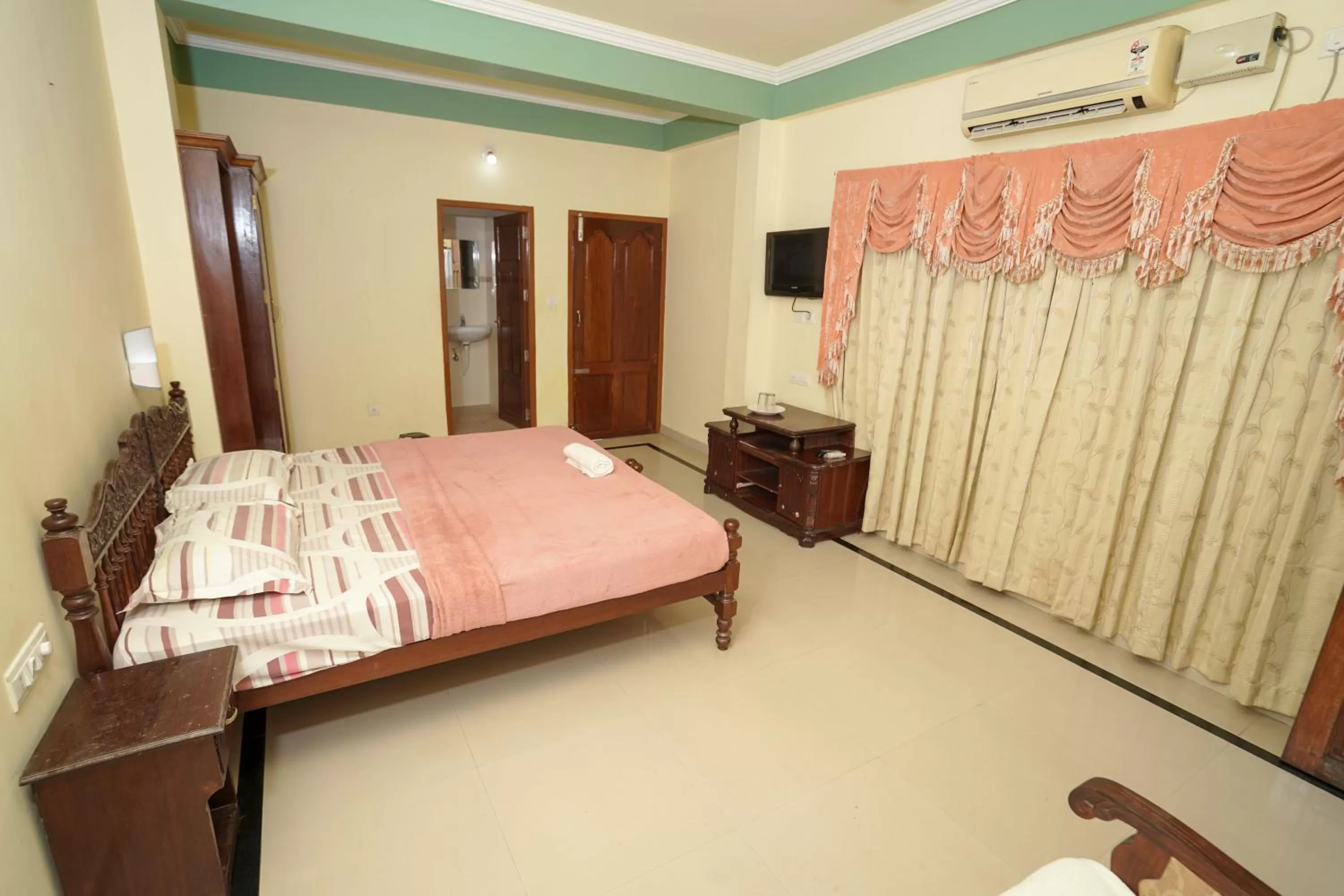 Bed in Sree Mookambika Beach Resort
