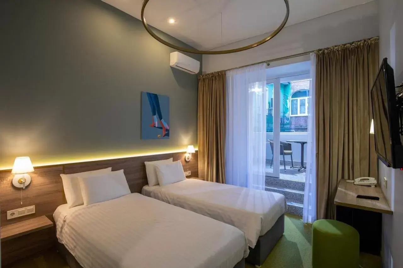 Twin Room with Balcony in Four Rooms City Twin Room with Balcony in Four Rooms City