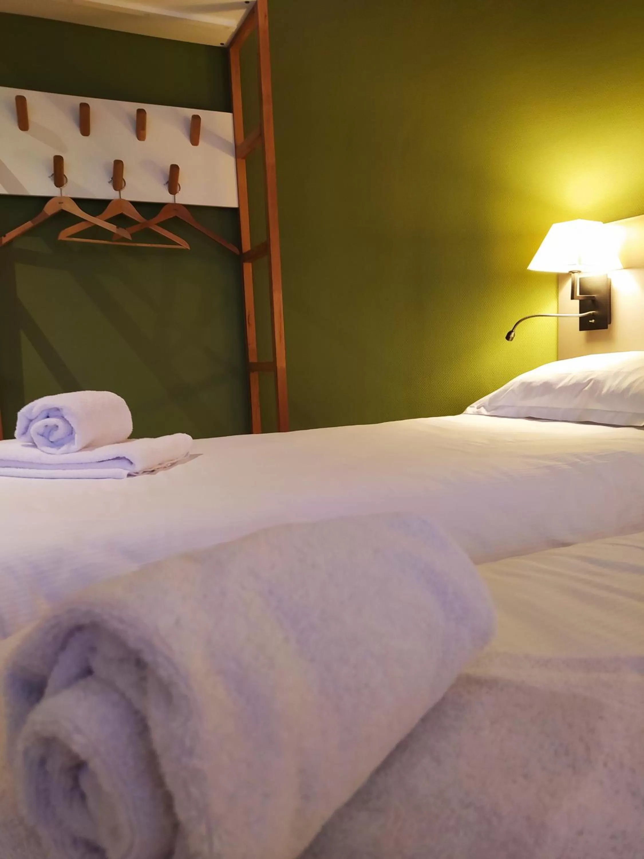 Bed in Hôtel le Corbusson