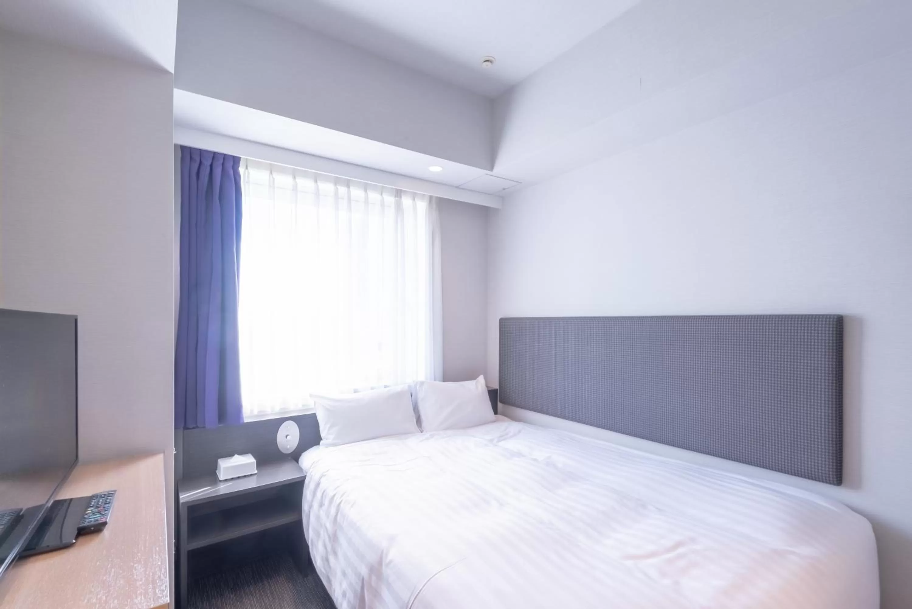 Bed in E Hotel Higashi Shinjuku