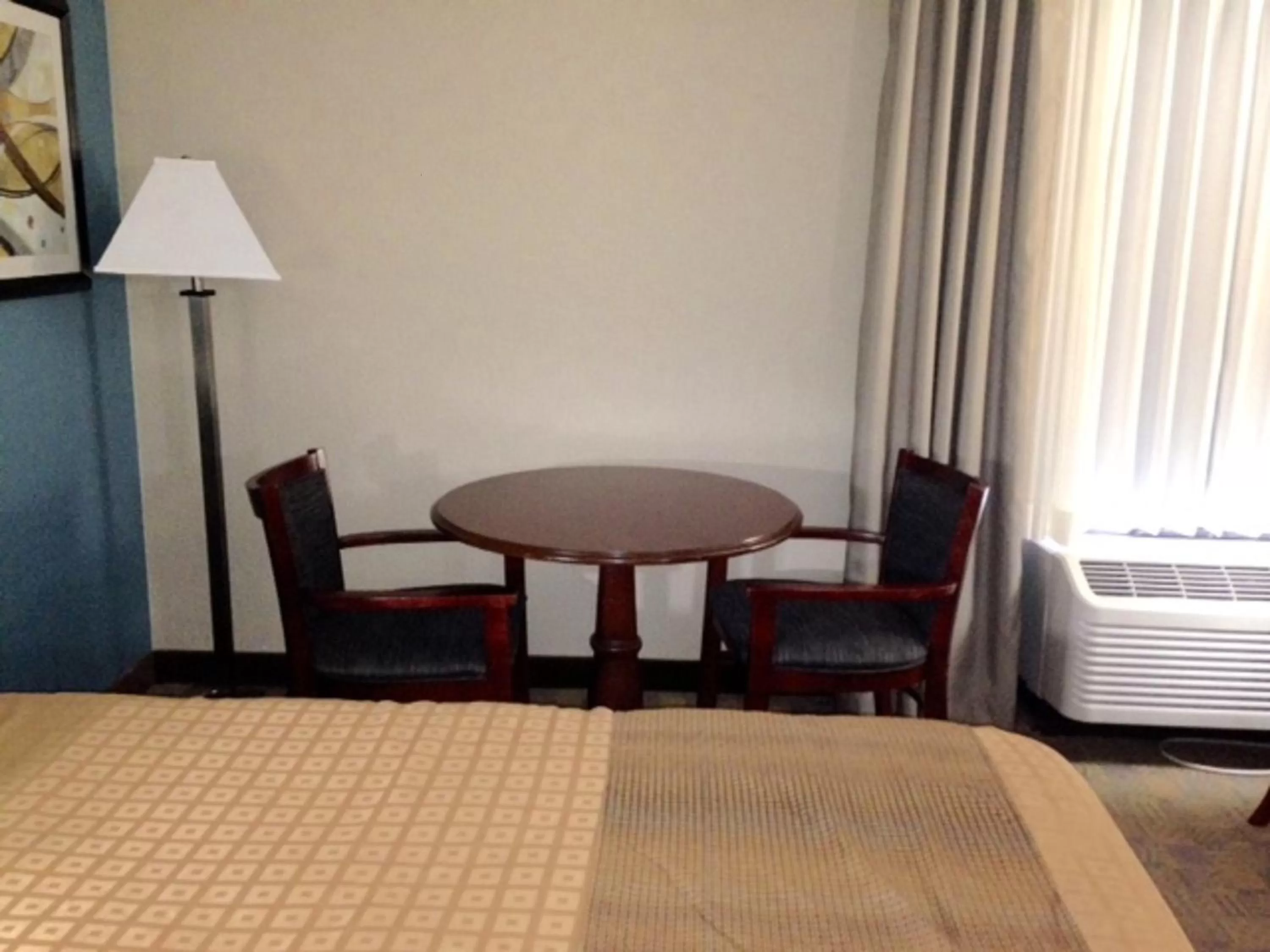 Seating area, Bed in Days Inn by Wyndham Englewood Dayton Airport