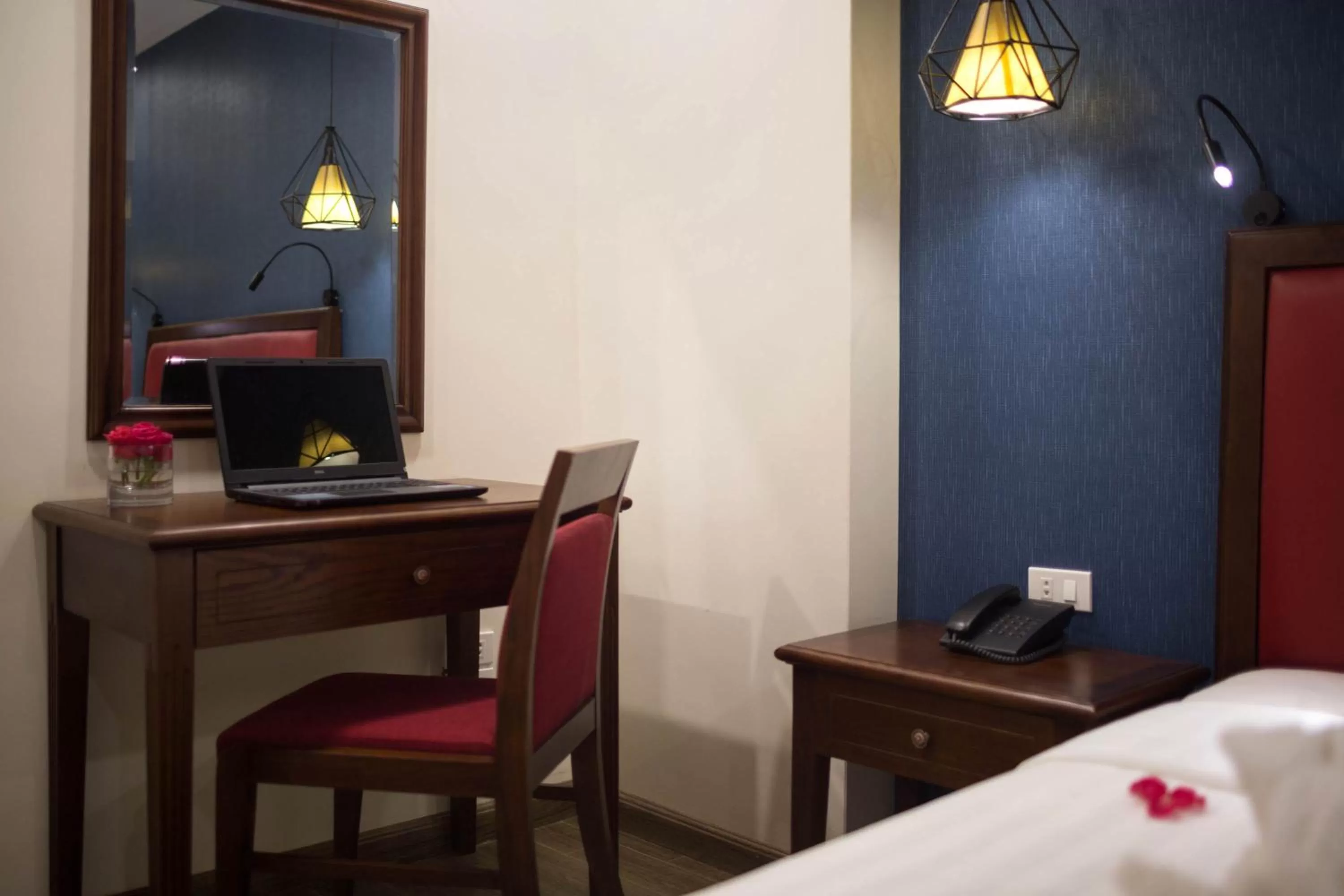 Seating area, Bed in Holiday Emerald Hotel