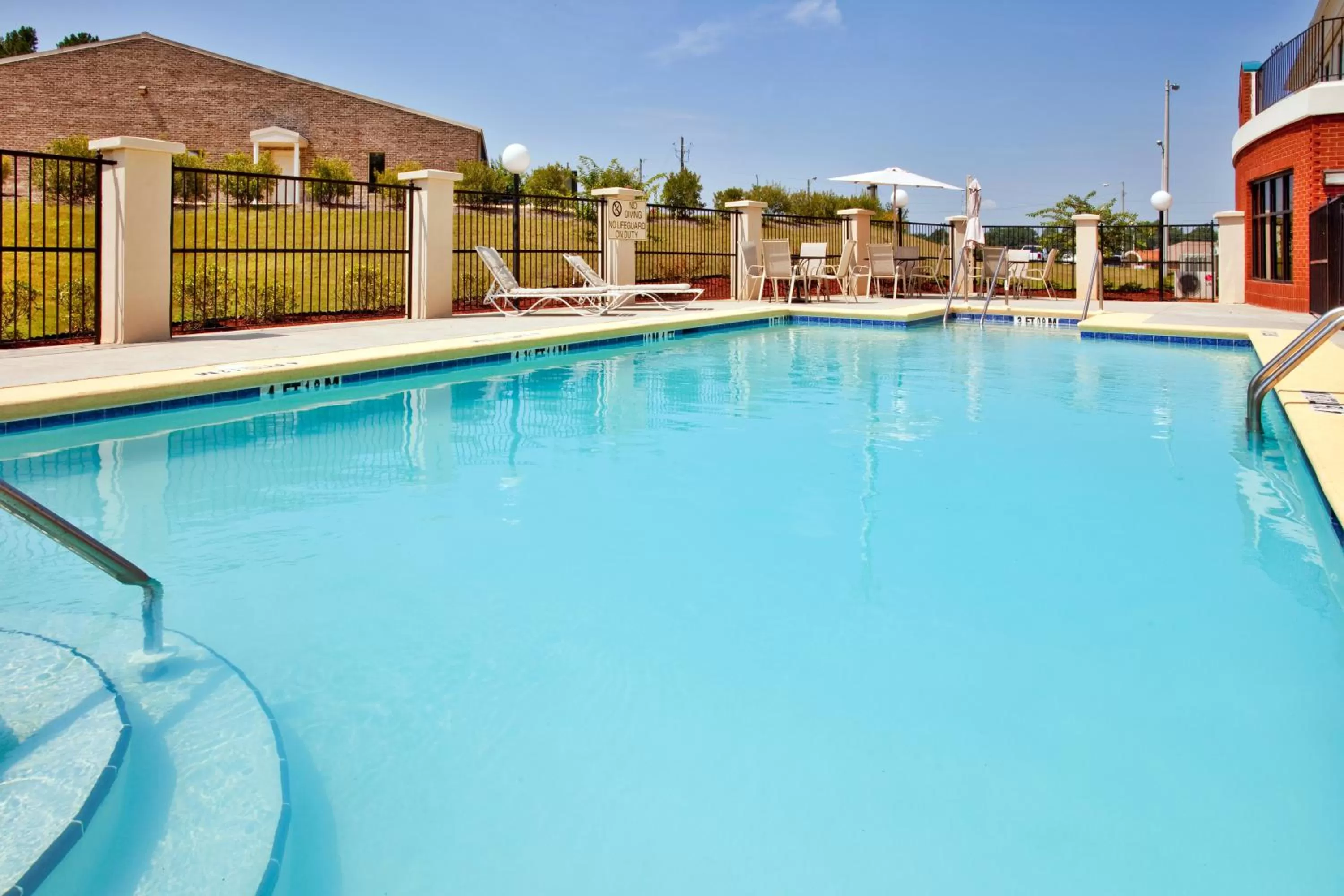 Swimming pool in Holiday Inn Express Hotel & Suites Selma, an IHG Hotel