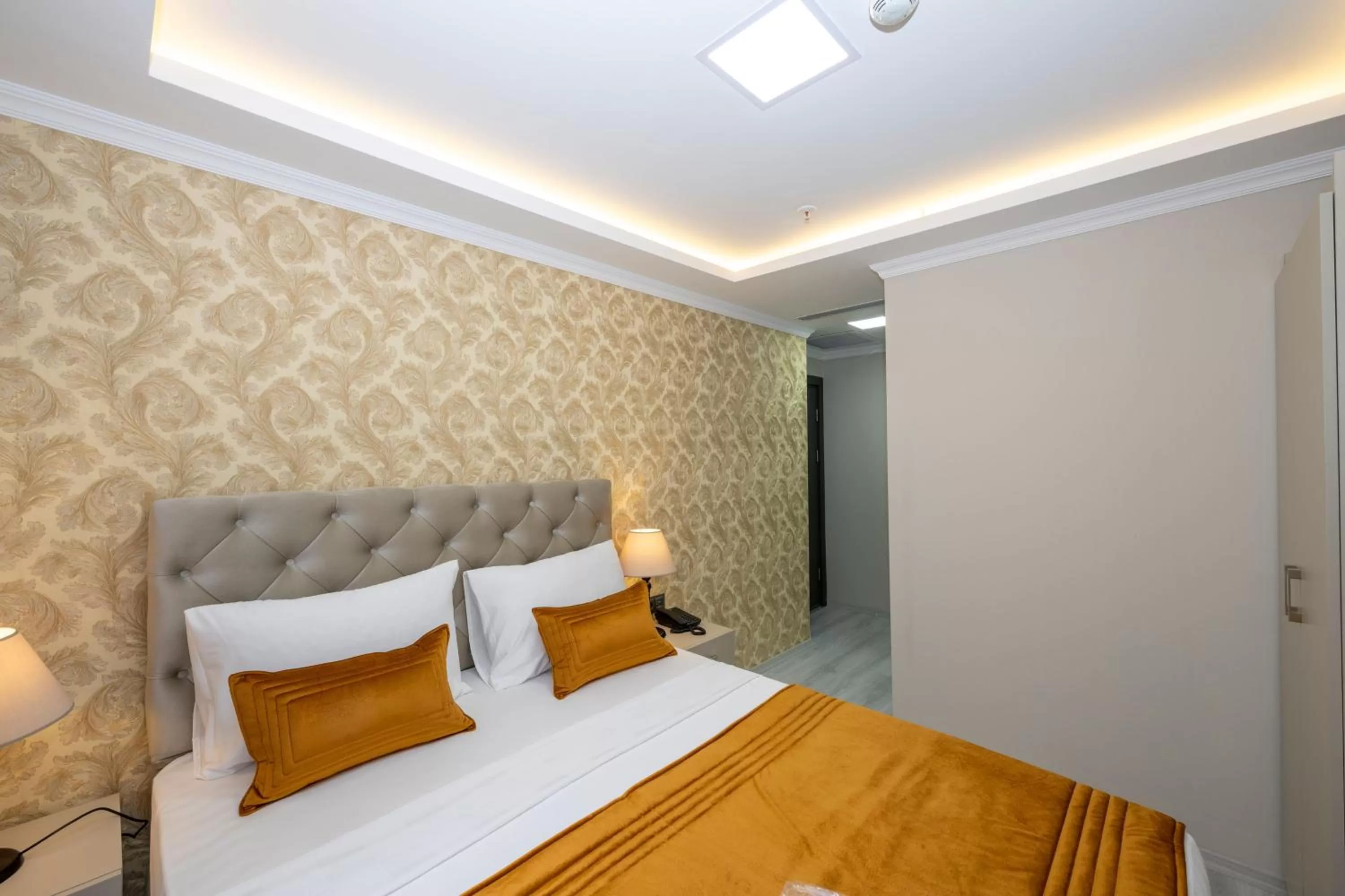 Bed in SKYSTAR DELUXE HOTEL