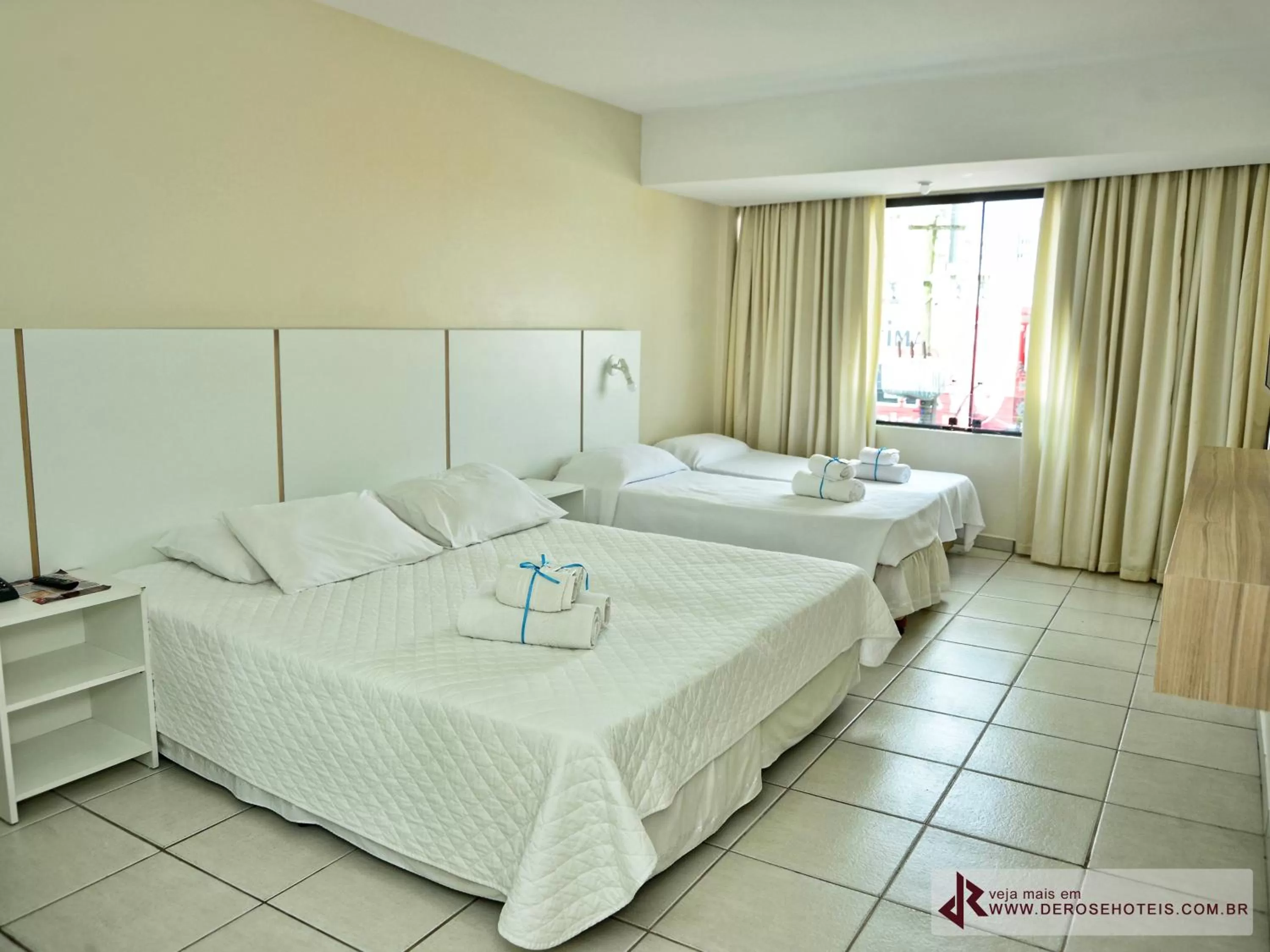 Bed in De Rose Palace Hotel