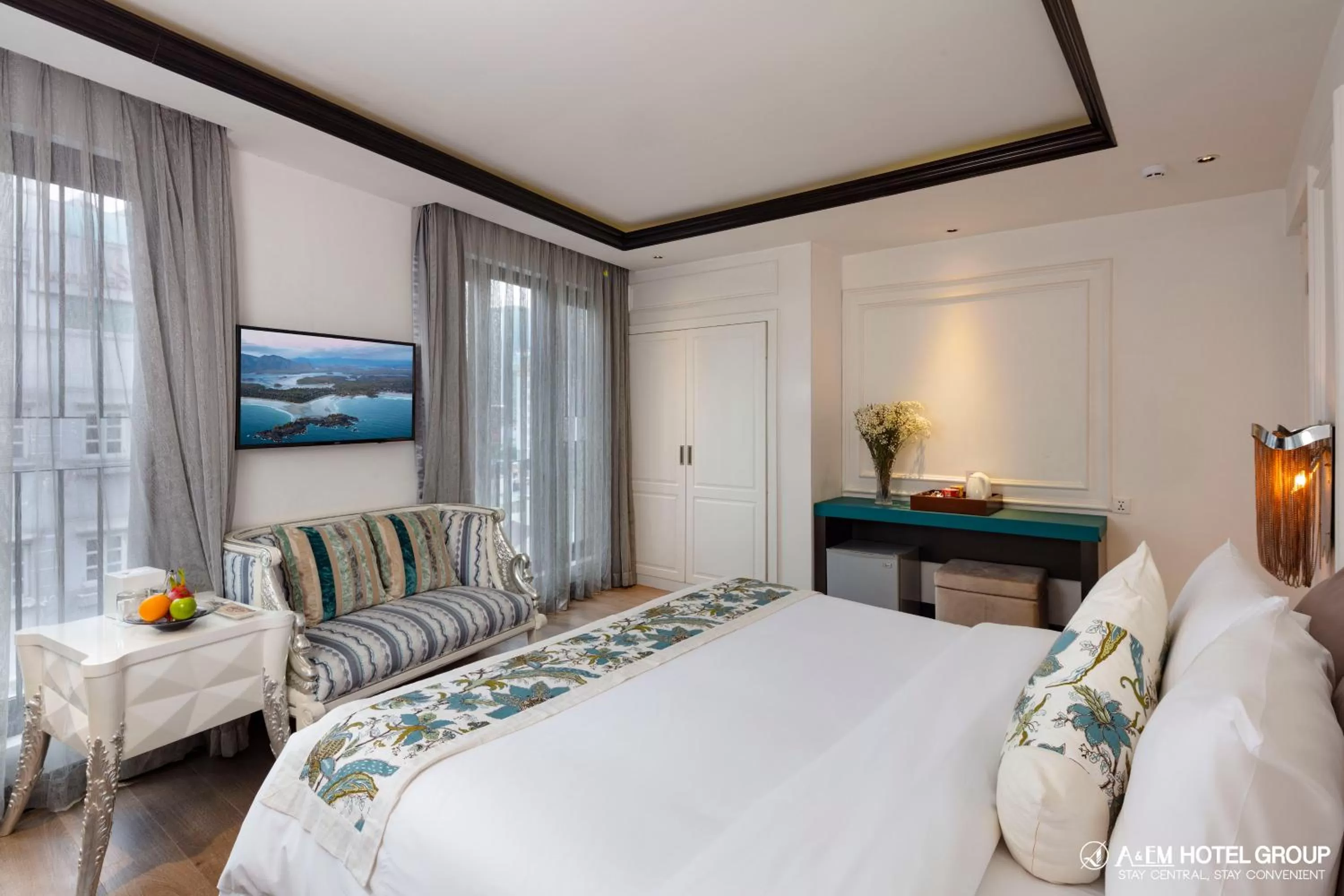 Bed in A&EM Saigon Hotel