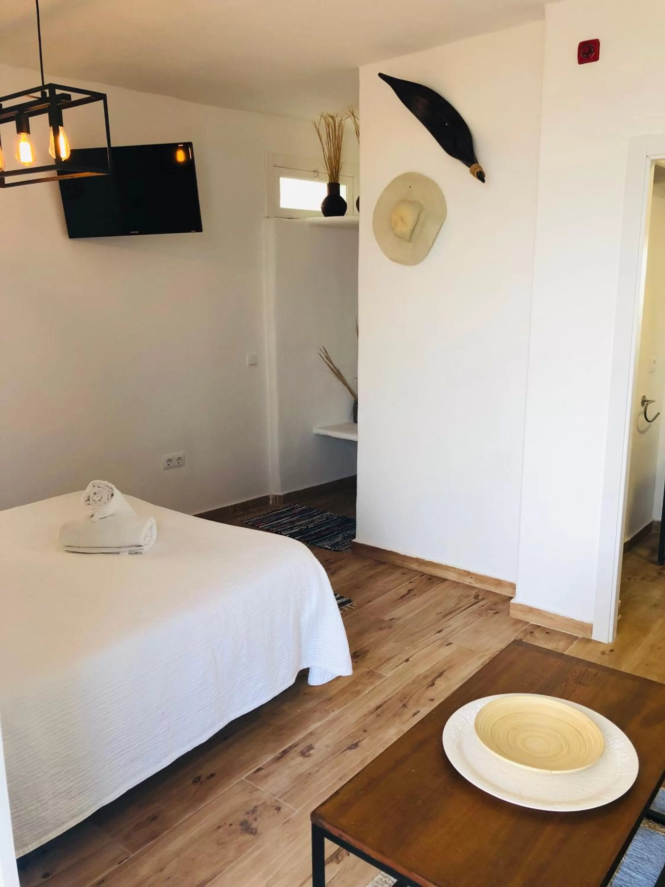 Bed in Blancos Rooms Hotel