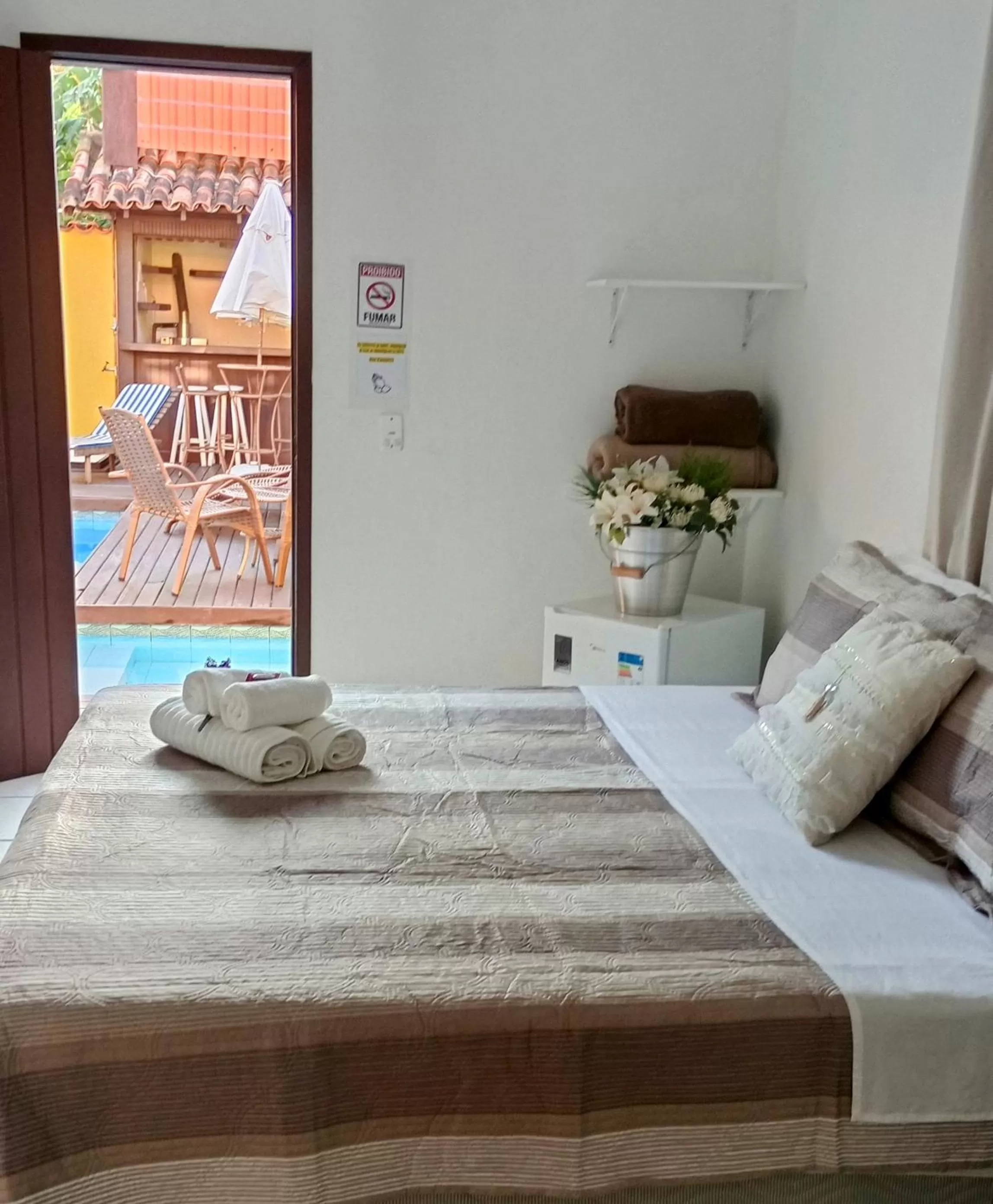 Bed in Hibiscos Pousada