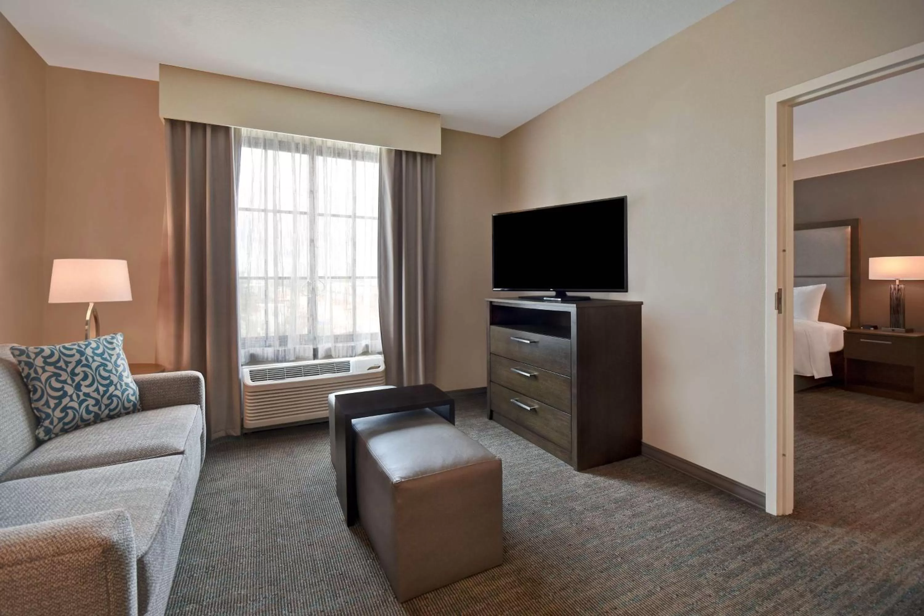 Living room, Bed in Homewood Suites By Hilton Orlando Flamingo Crossings, Fl