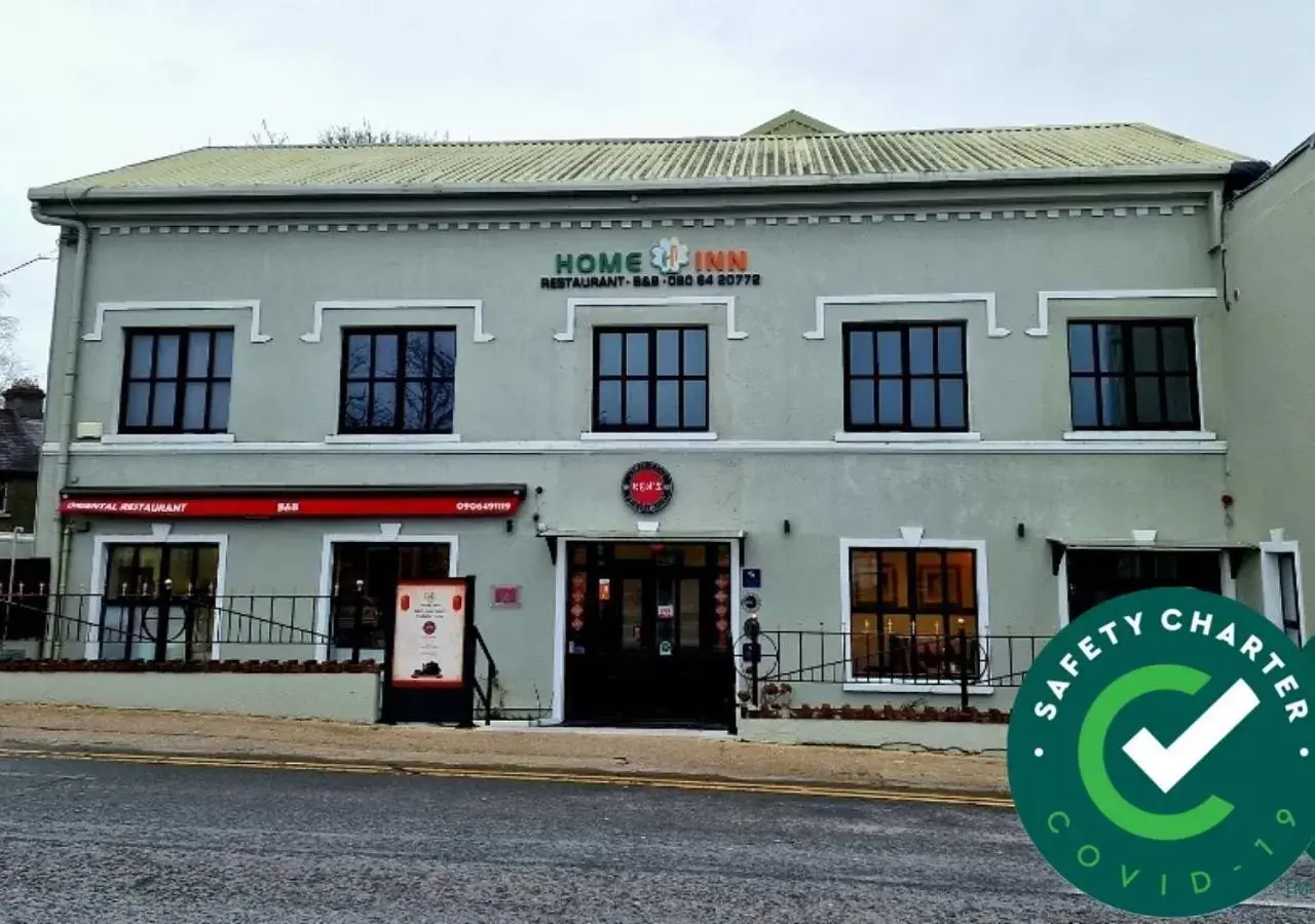 Property logo or sign, Property Building in Home Inn Property logo or sign, Property Building in Home Inn