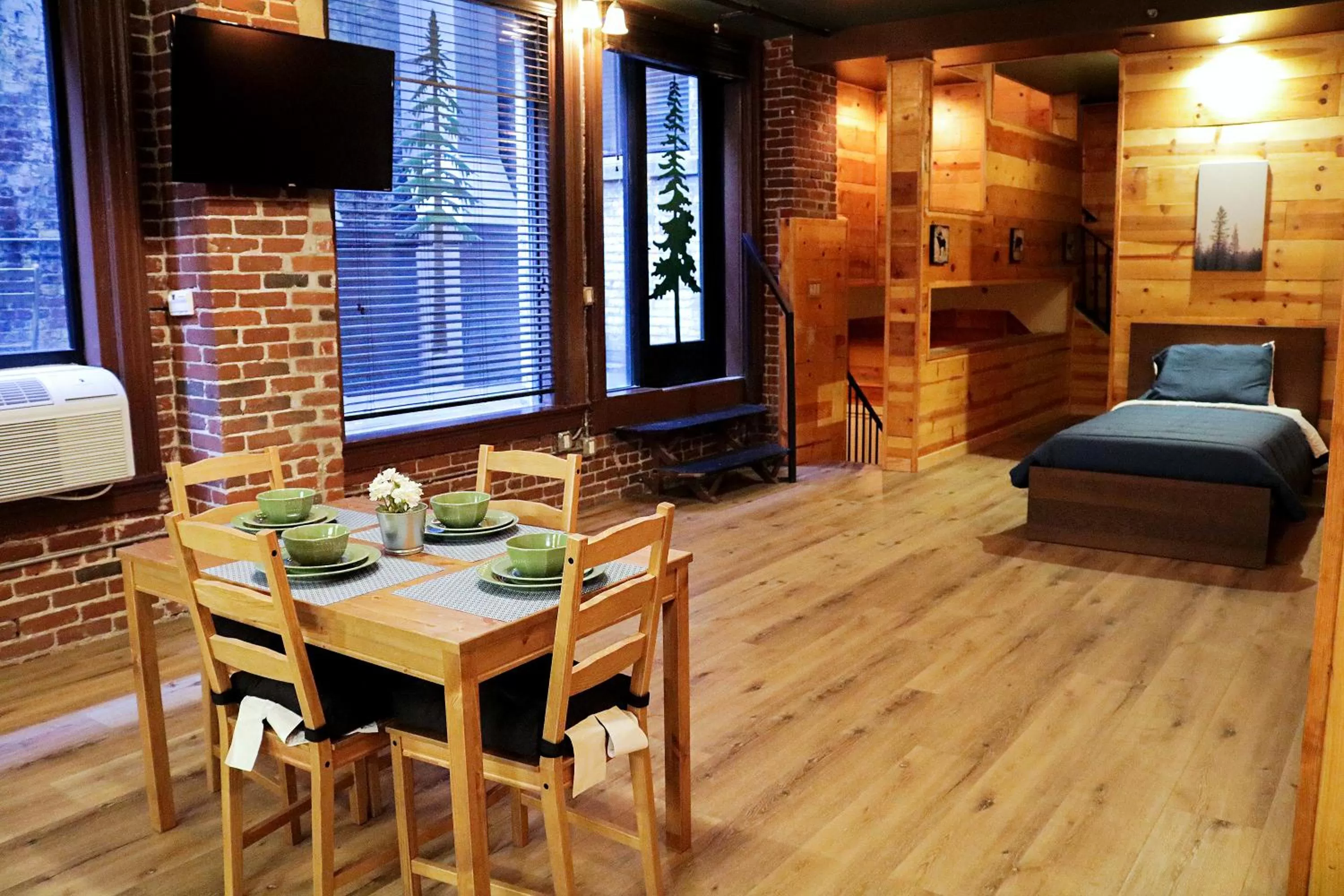 Bed, Dining Area in The Haas Suites