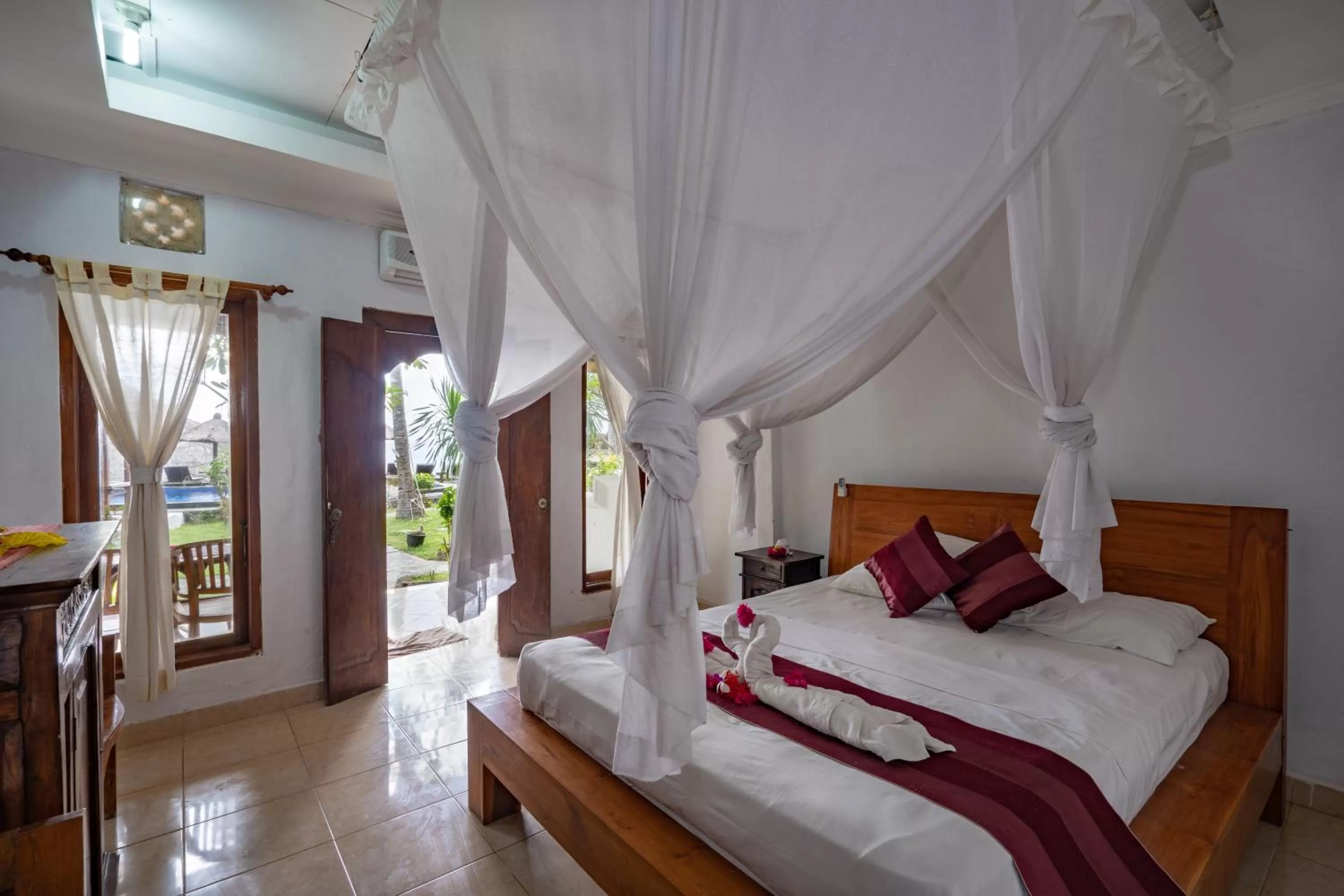 Bed in Mushroom Beach Bungalows