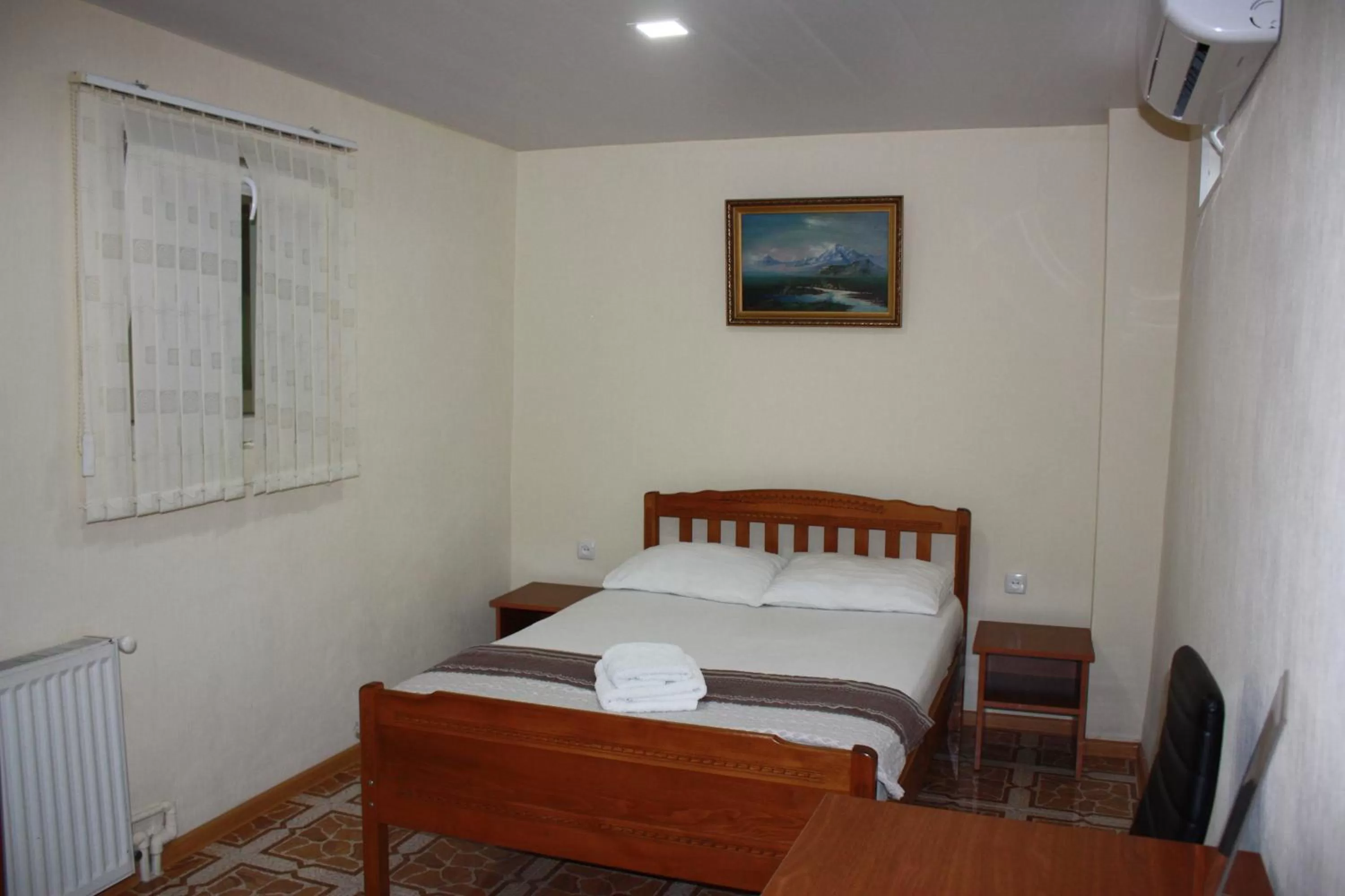 Living room, Bed in Paradise Hotel