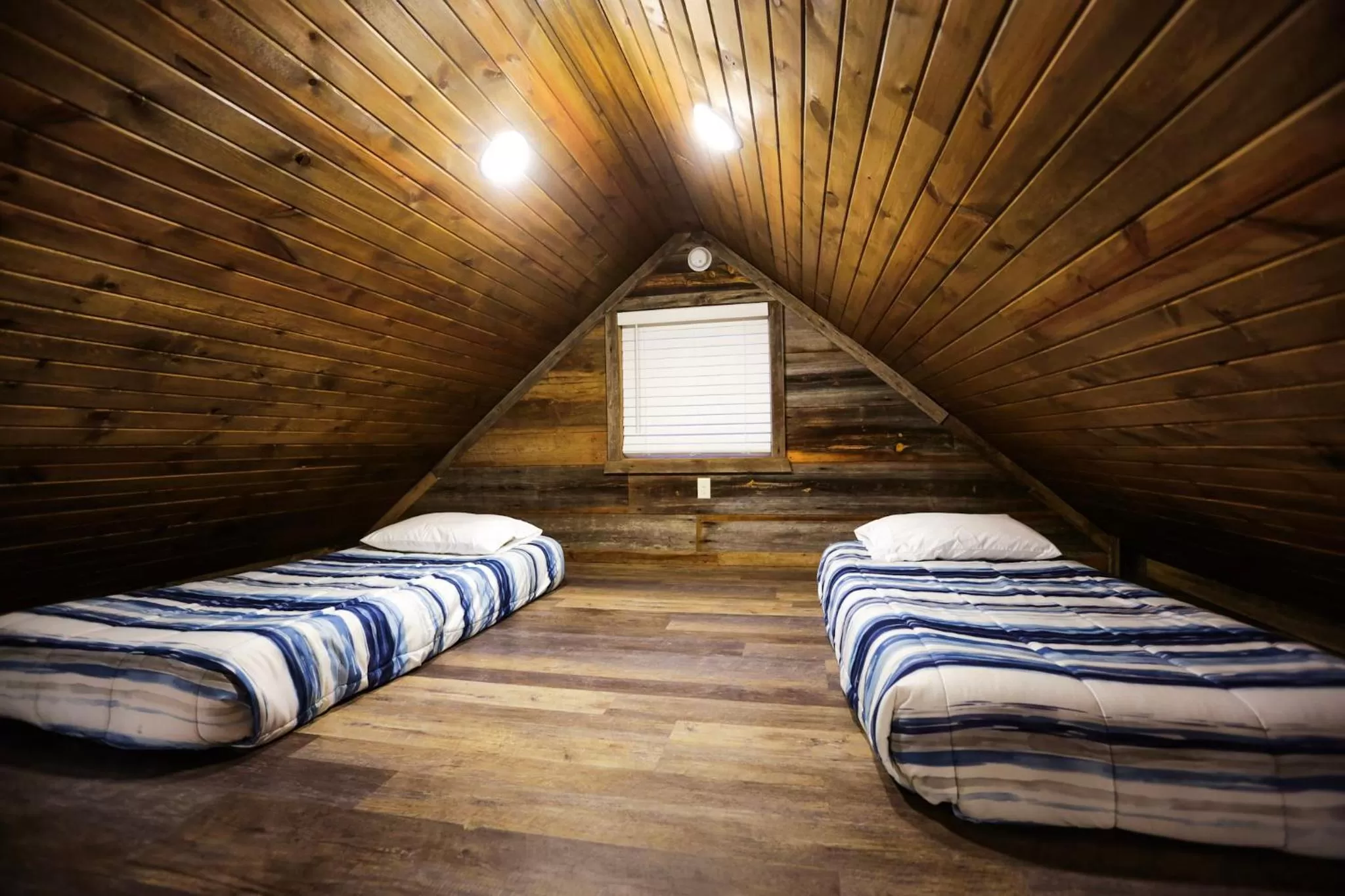 Bedroom in Knotty Squirrel Cabins