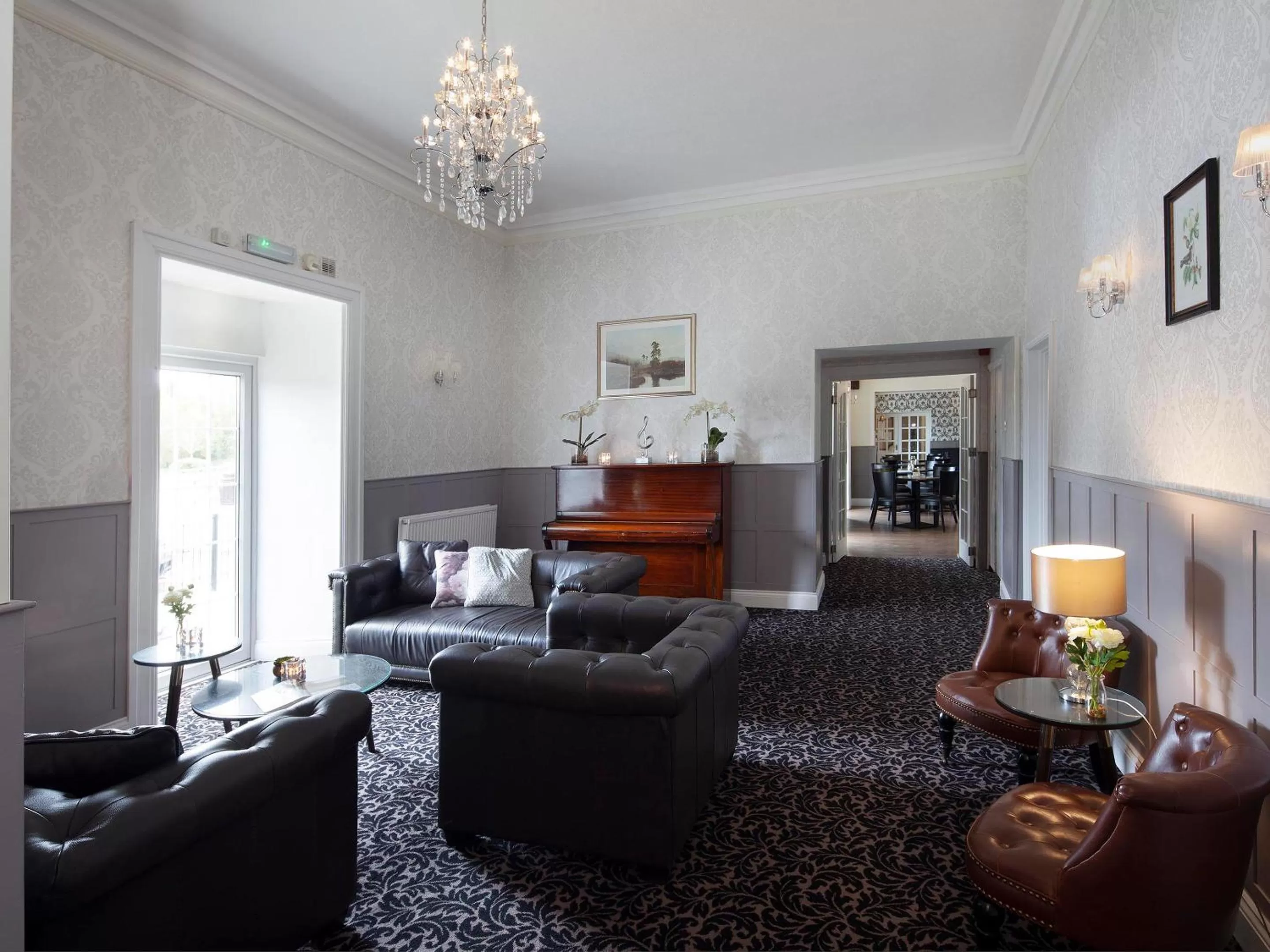 Communal lounge/ TV room in Elfordleigh Hotel