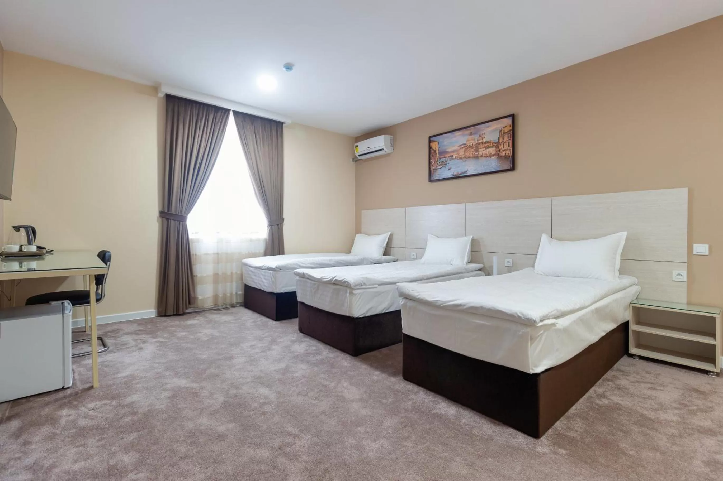 Bed in Musafir Hotel