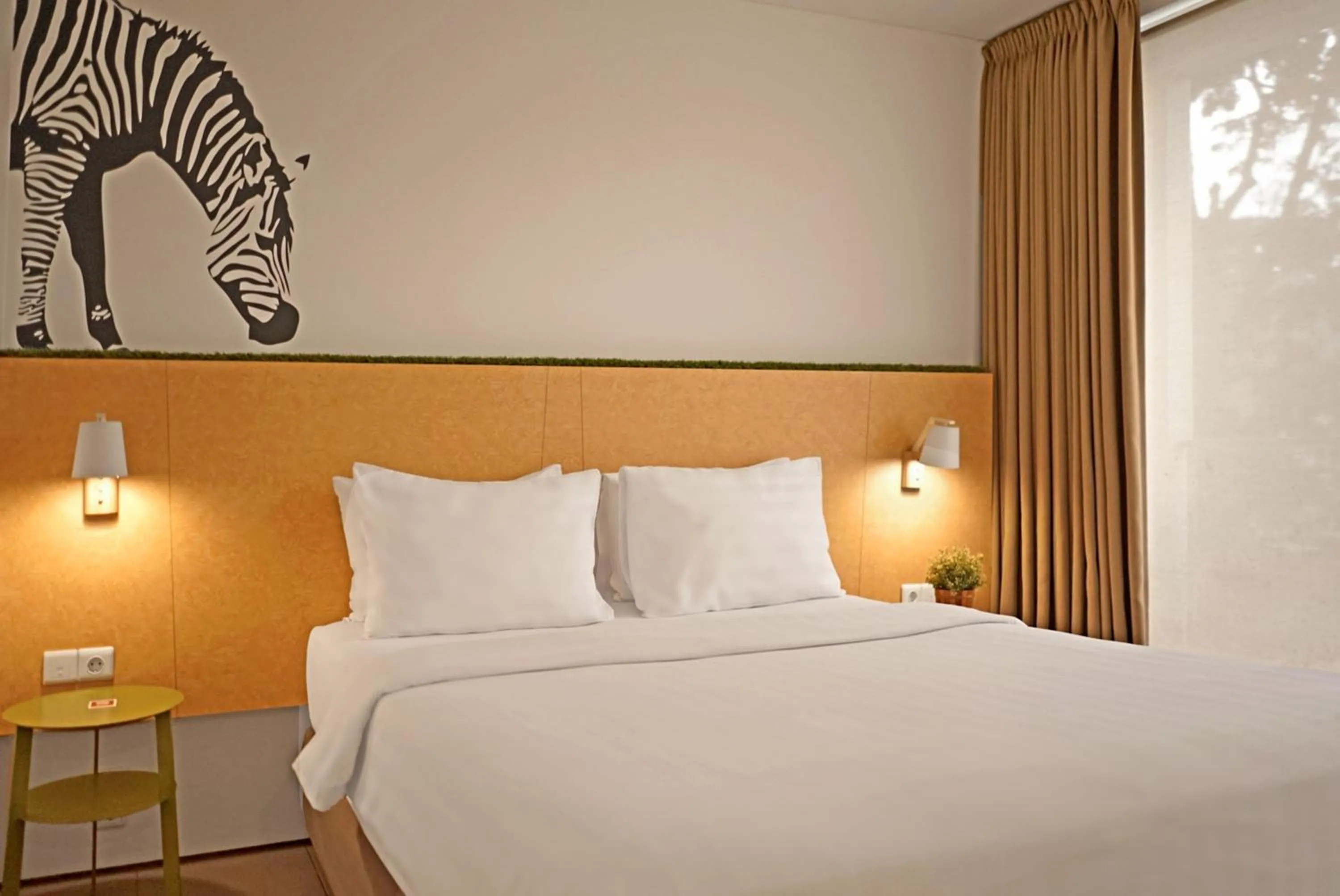 Bed in Malaka Hotel Bandung