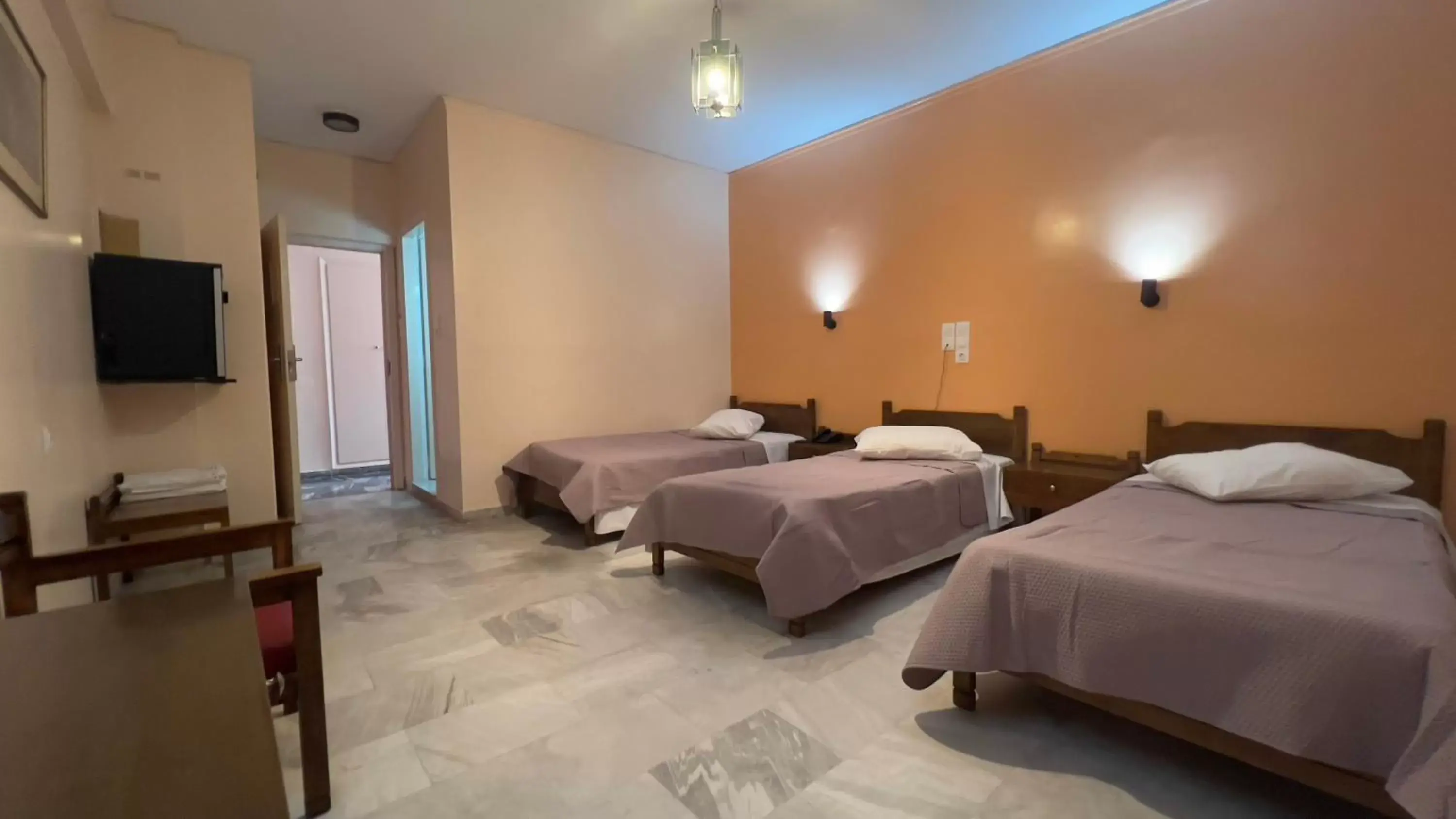 Standard Triple Room in Hotel Cosmos Standard Triple Room in Hotel Cosmos