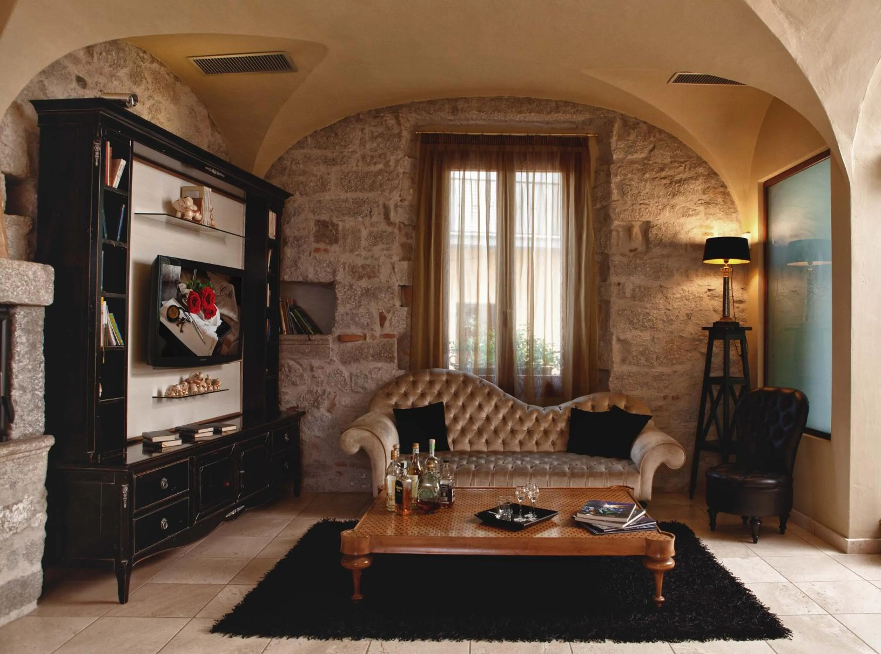 Communal lounge/ TV room in La Locanda Del Conte Mameli - Boutique Hotel & Suite SPA
