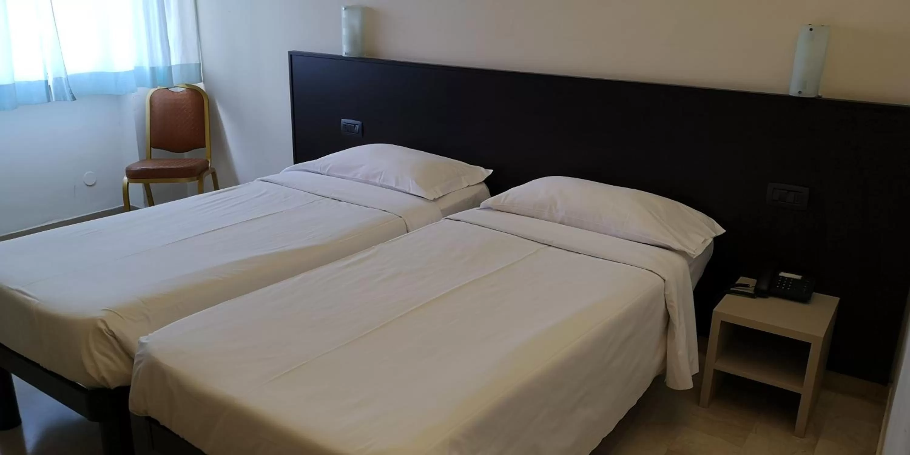 Bed in AUTO PARK Hotel