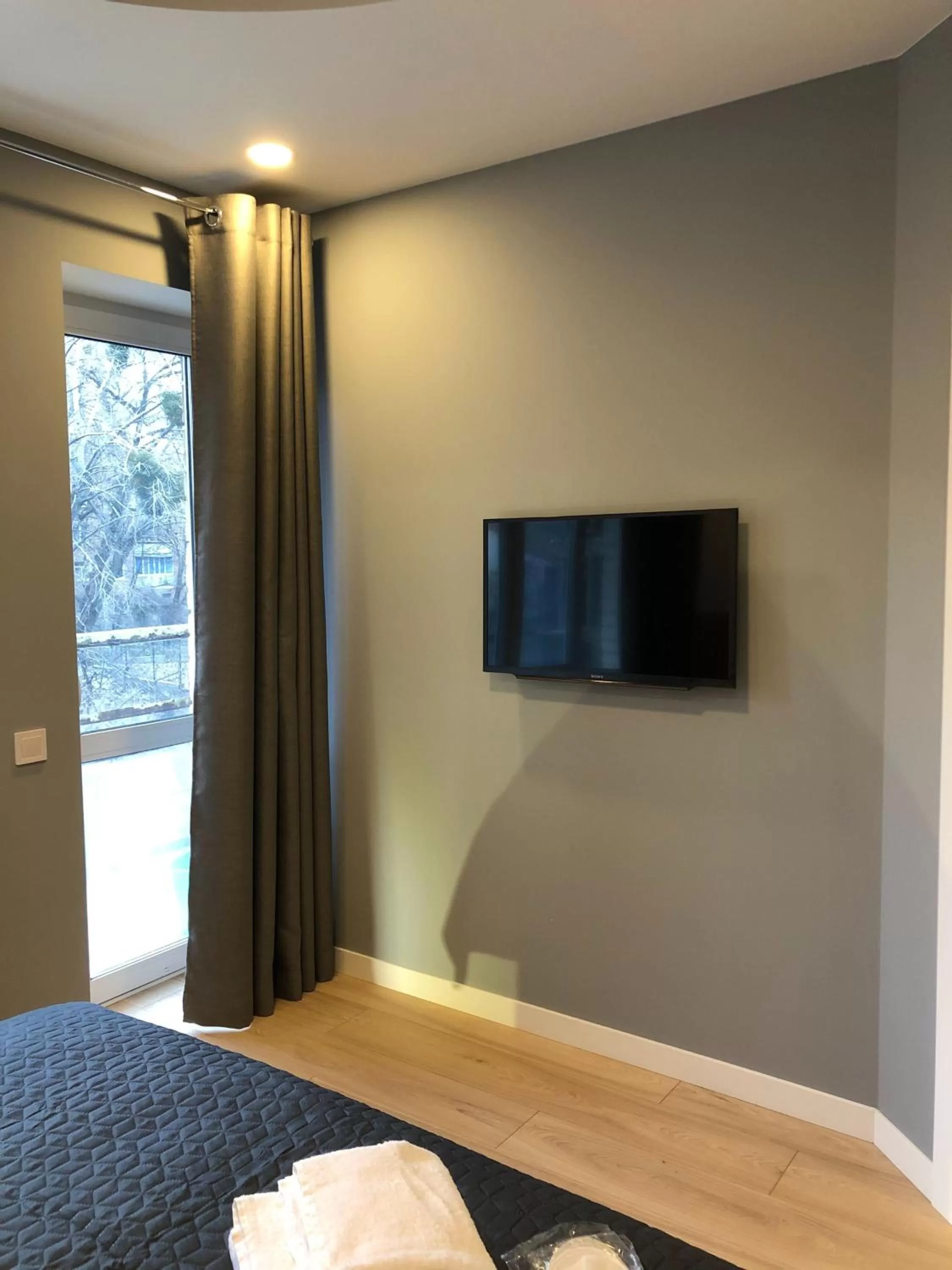 Bed, TV/Entertainment Center in Partner Guest House