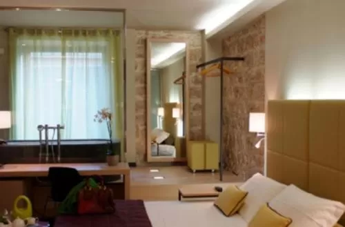 Bedroom, Bed in El Homs Palace Hotel