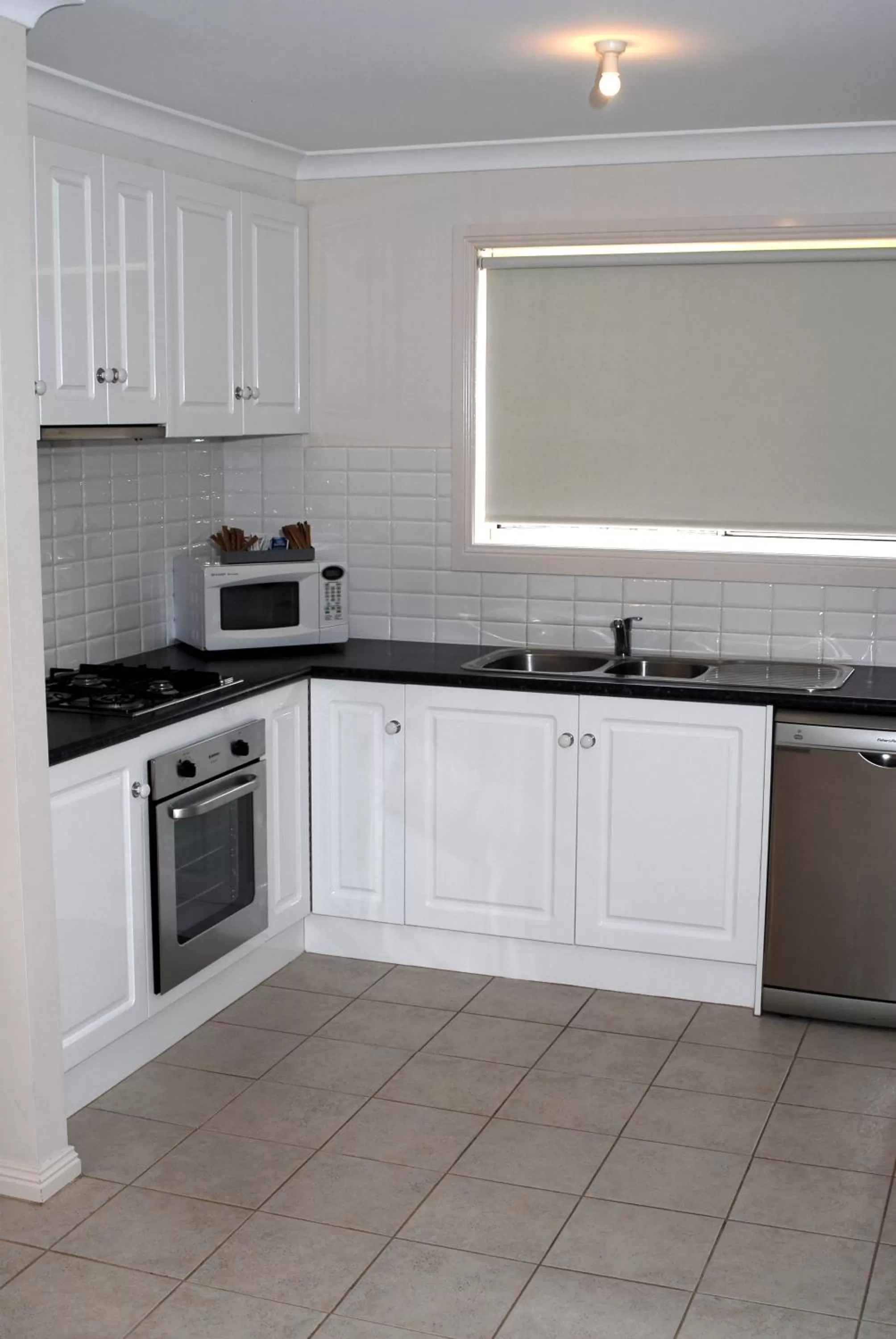 Kitchen or kitchenette in Melton Motor Inn and Apartments