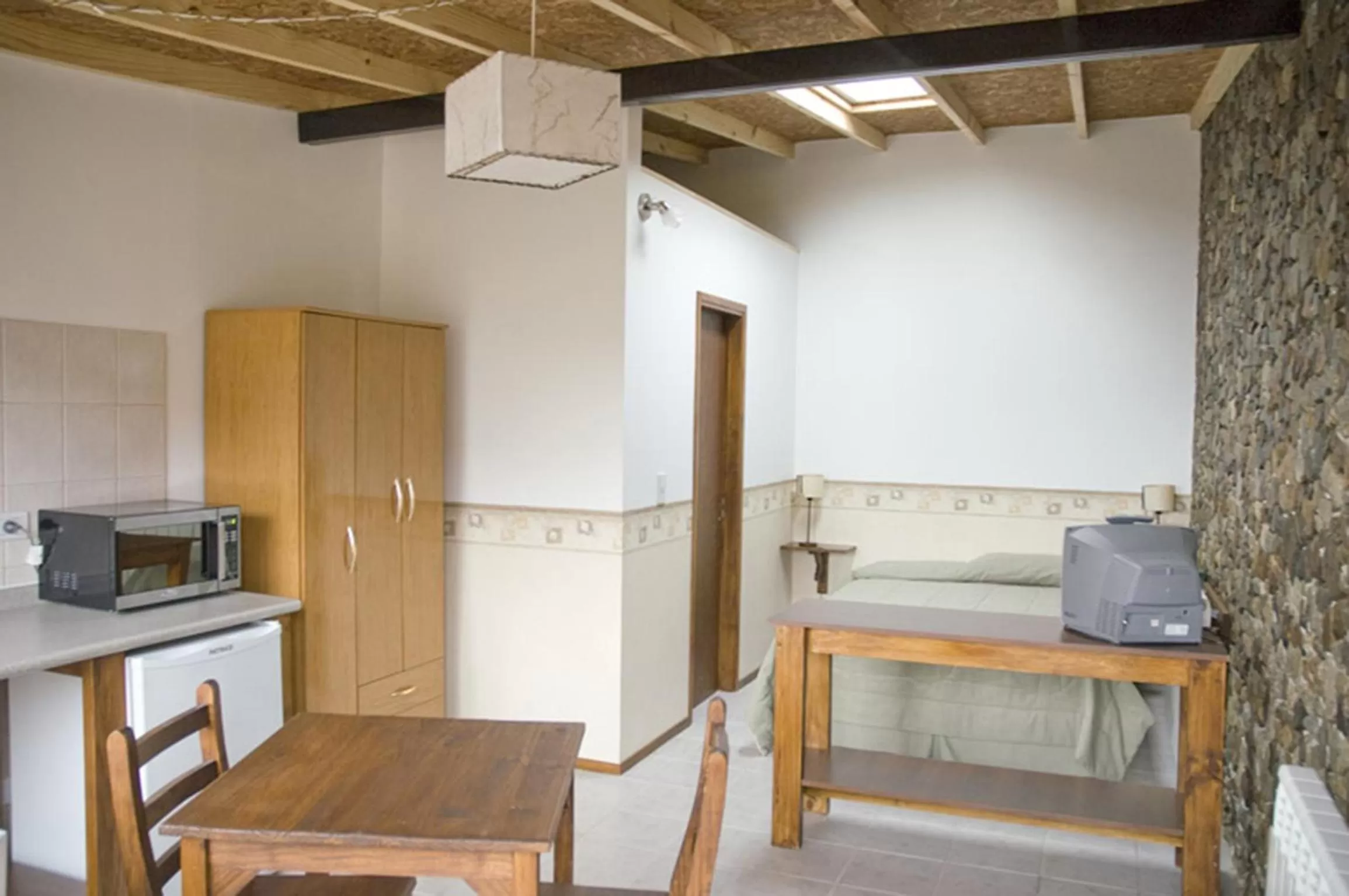 Living room, Kitchen/Kitchenette in Hosteria Sloggett