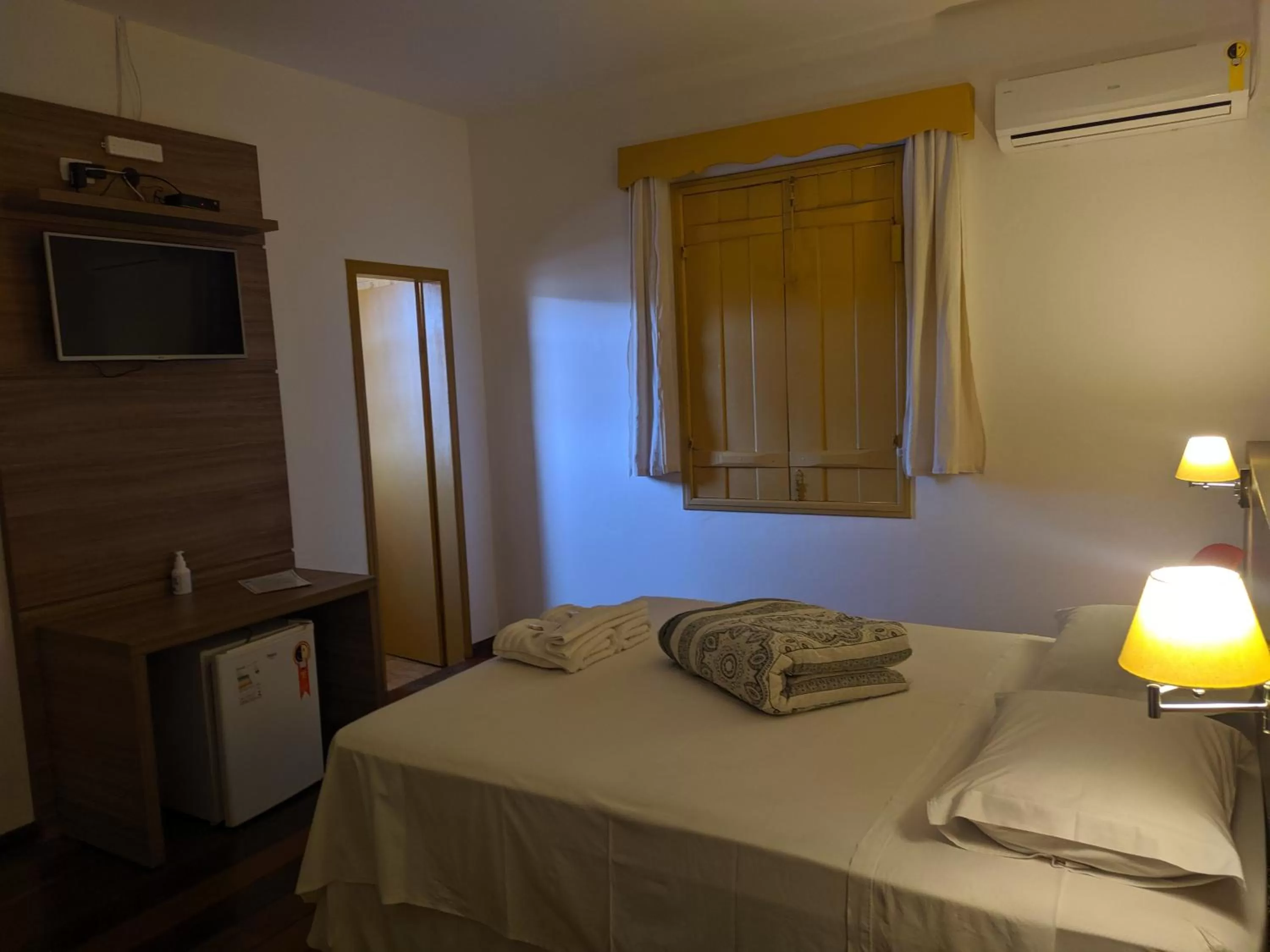 Bed in Pousada o Amanhecer