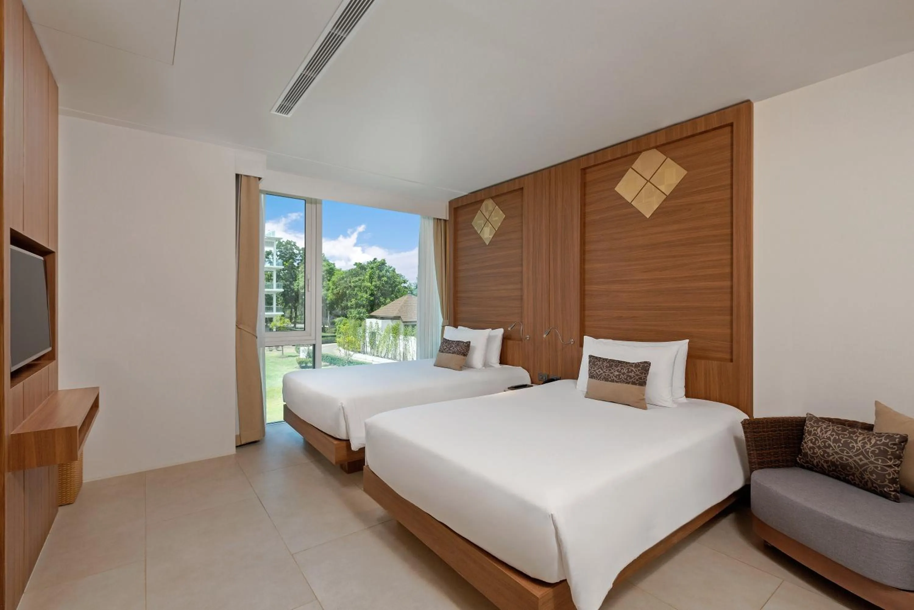 Photo of the whole room, Bed in Splash Beach Resort Phuket Family-Friendly Water Park Resort Near Phuket Airport