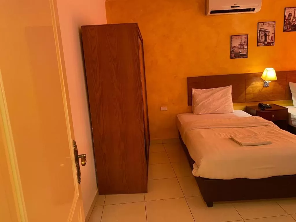 Bed in Zaina Plaza Hotel