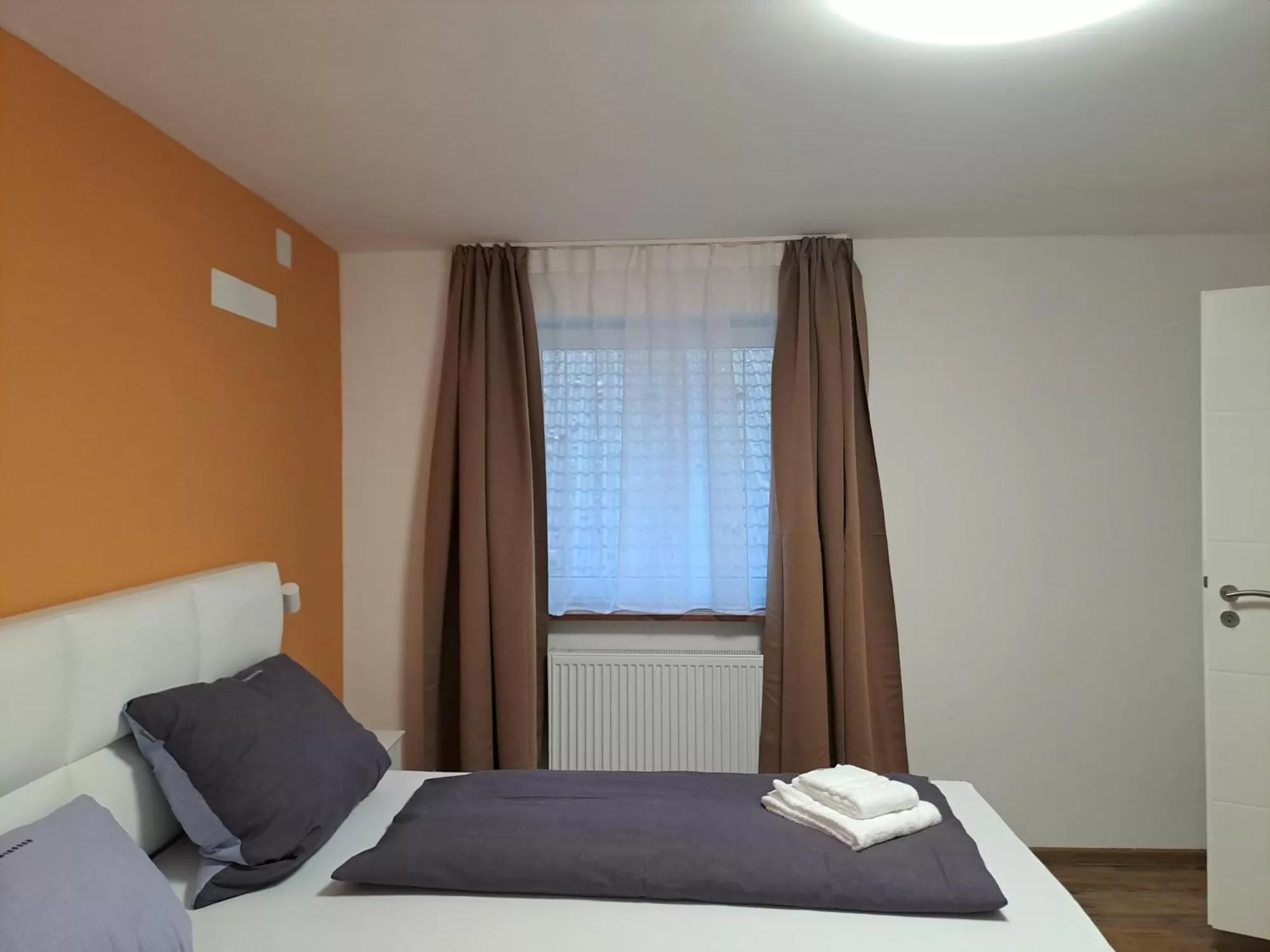 Bed in Hotel Grüner Baum - Melissone Italian Restaurant